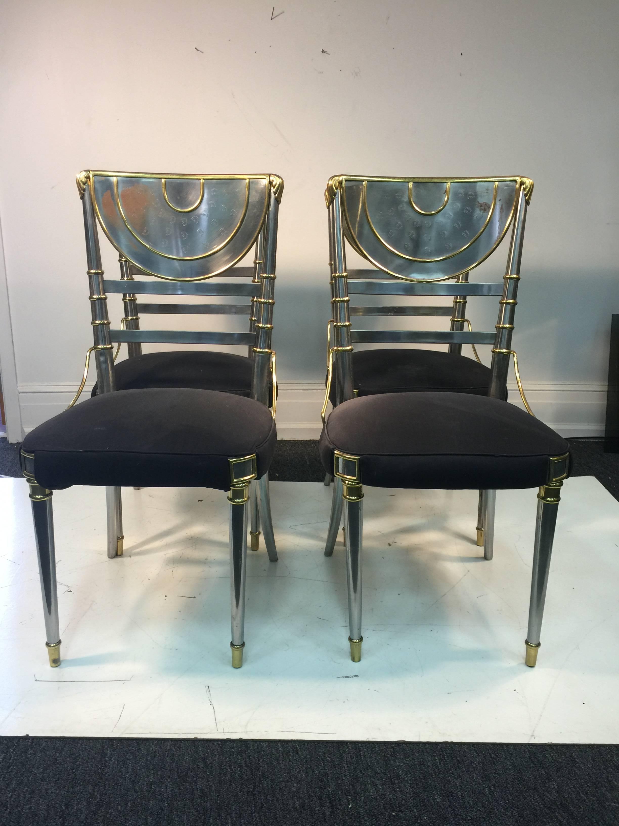 An exceptional set of four French dining room chairs in steel with brass accents and velvet seat by Maison Jansen, circa 1940.