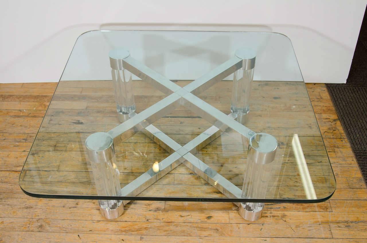 A sensational Karl Springer style X-base coffee or cocktail table in Lucite and chrome with 3/4