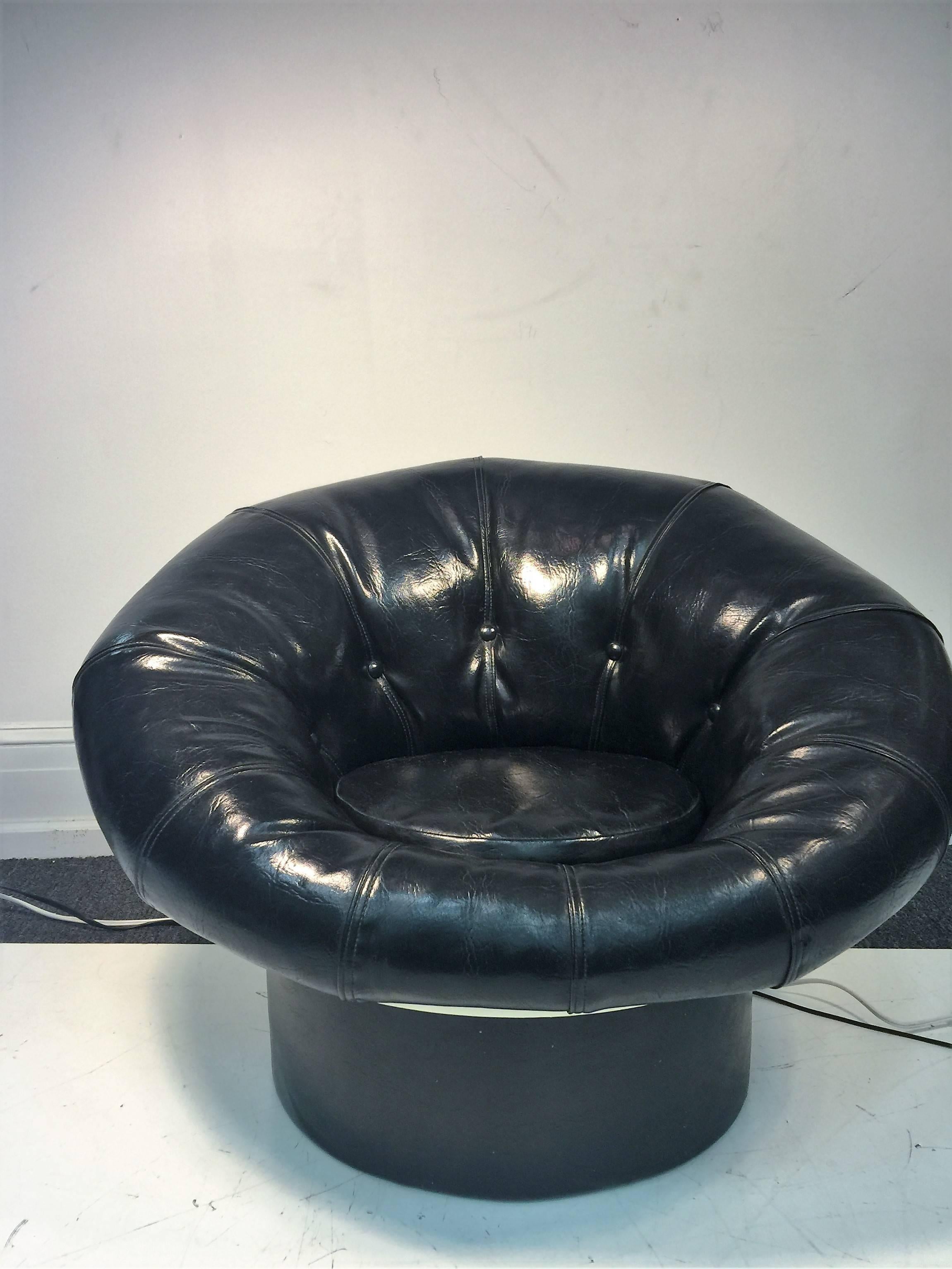 Great looking tufted upholstered in glossy black leatherette pouf chair with white fiberglass base. Designed in the manner of Joe Colombo this chair is comfortable and a stylish seat for your Modern Interior.