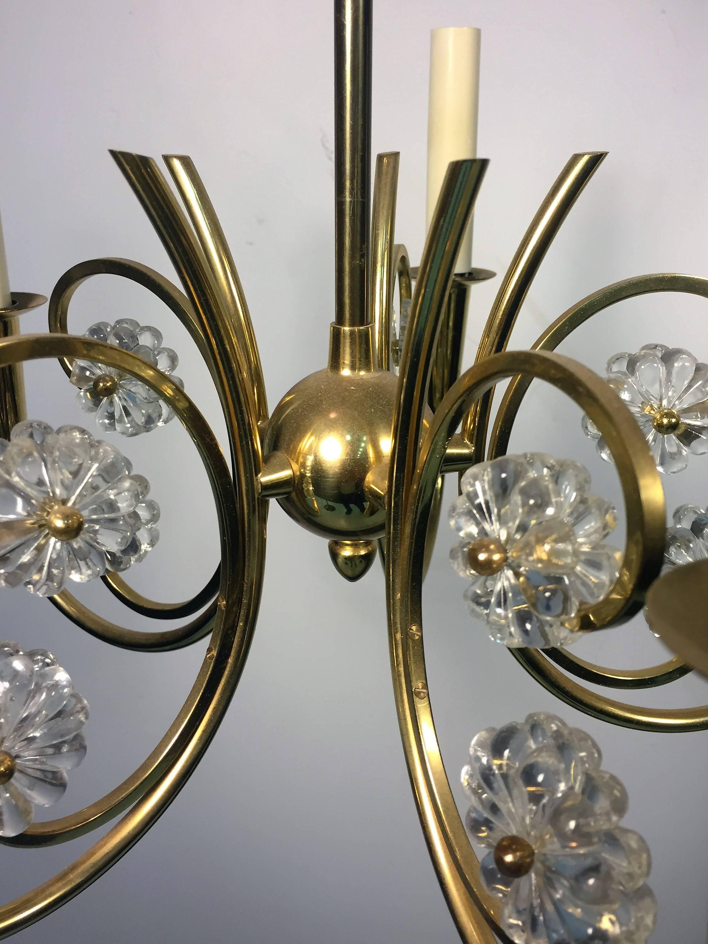 Fantastic diminutive pair of high style polished brass and clear crystal floret design five-arm chandeliers with curved tendril design arms and brass ball accented florets. Accompanied by their original beautiful solid brass canopies reminiscent of