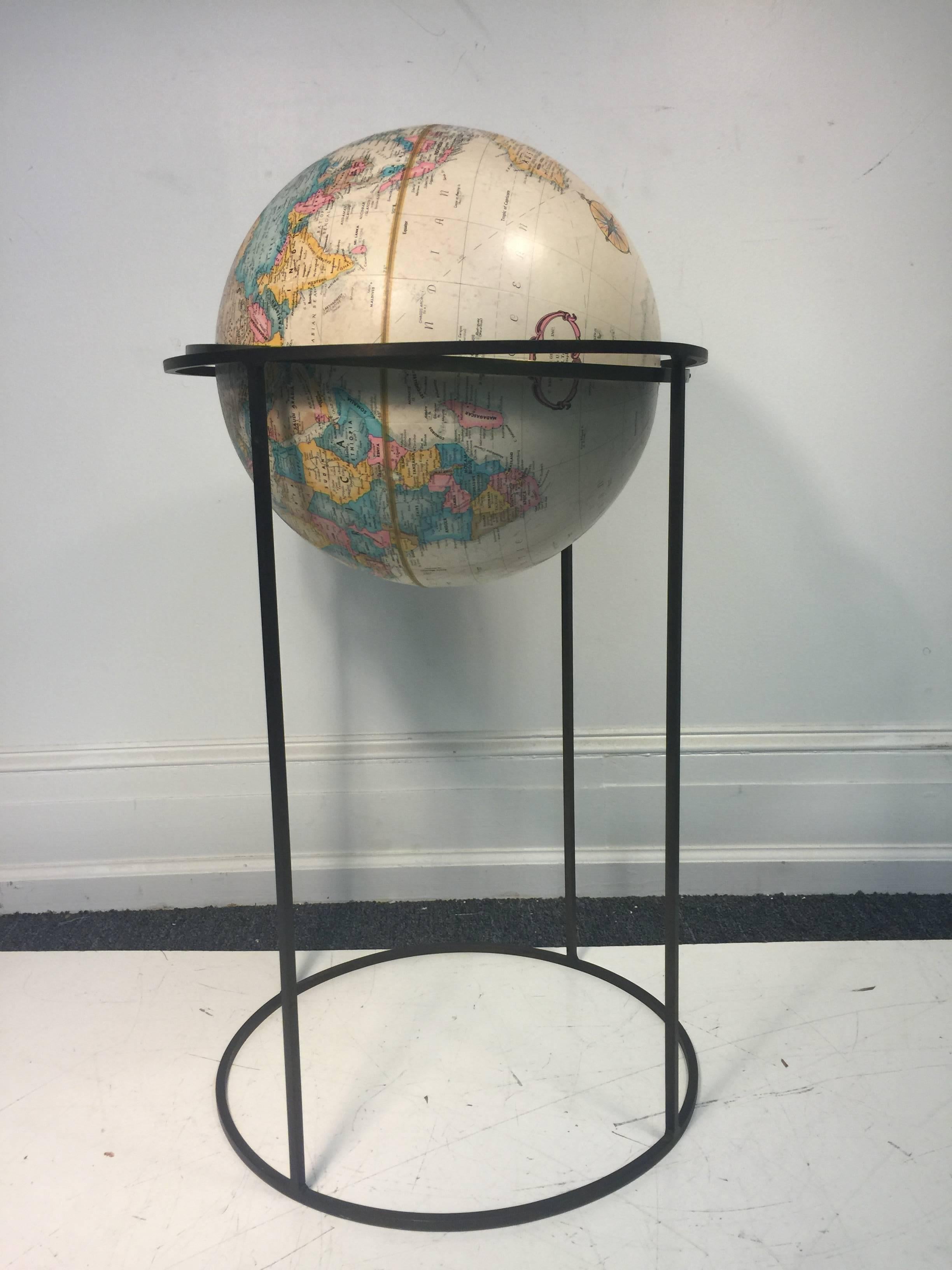 A modernistic world rotating globe with great design by Paul mccobb 