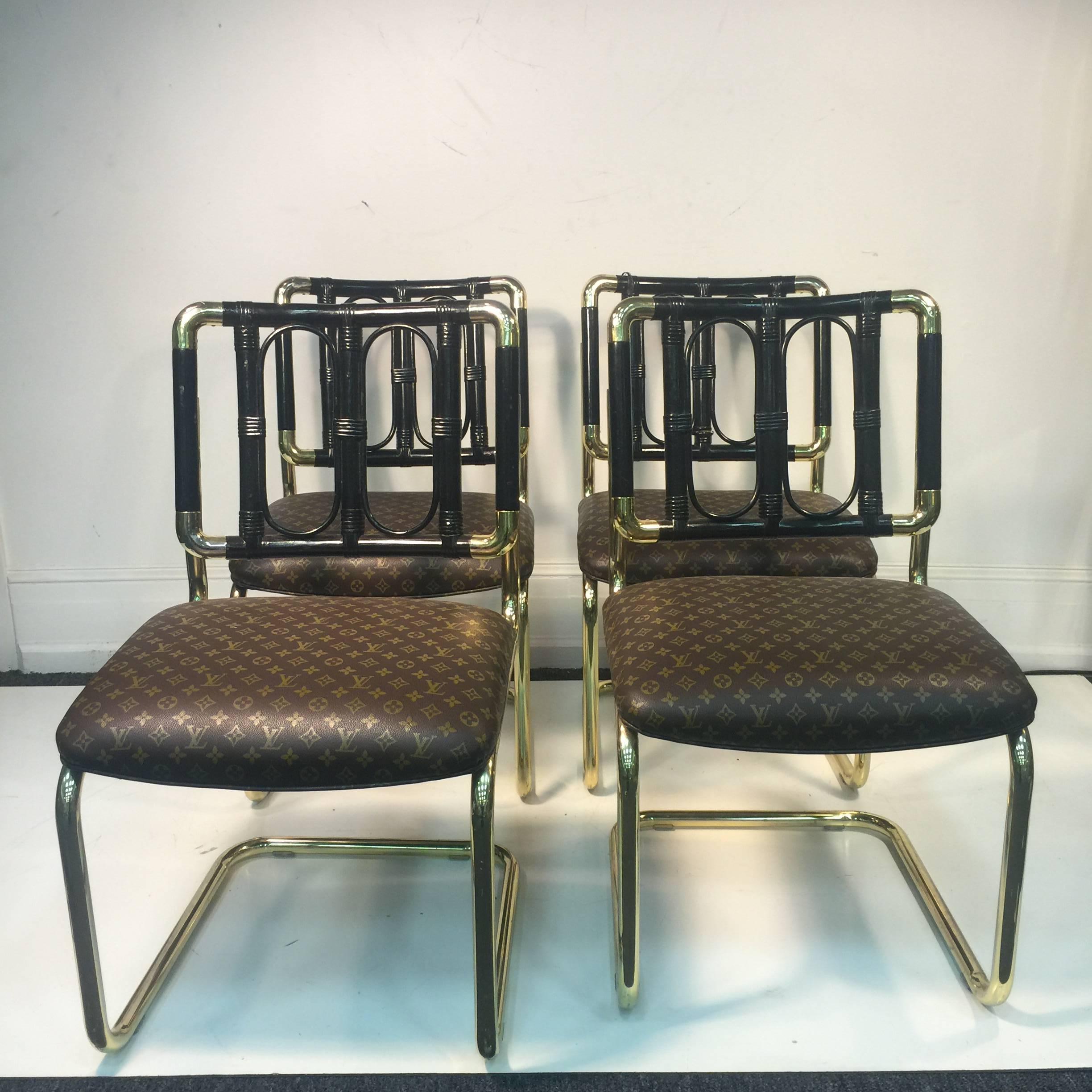 A luxurious set of four brass Italian chairs upholstered in Louis Vuitton leather, circa 1970. Good condition with age appropriate wear.
 