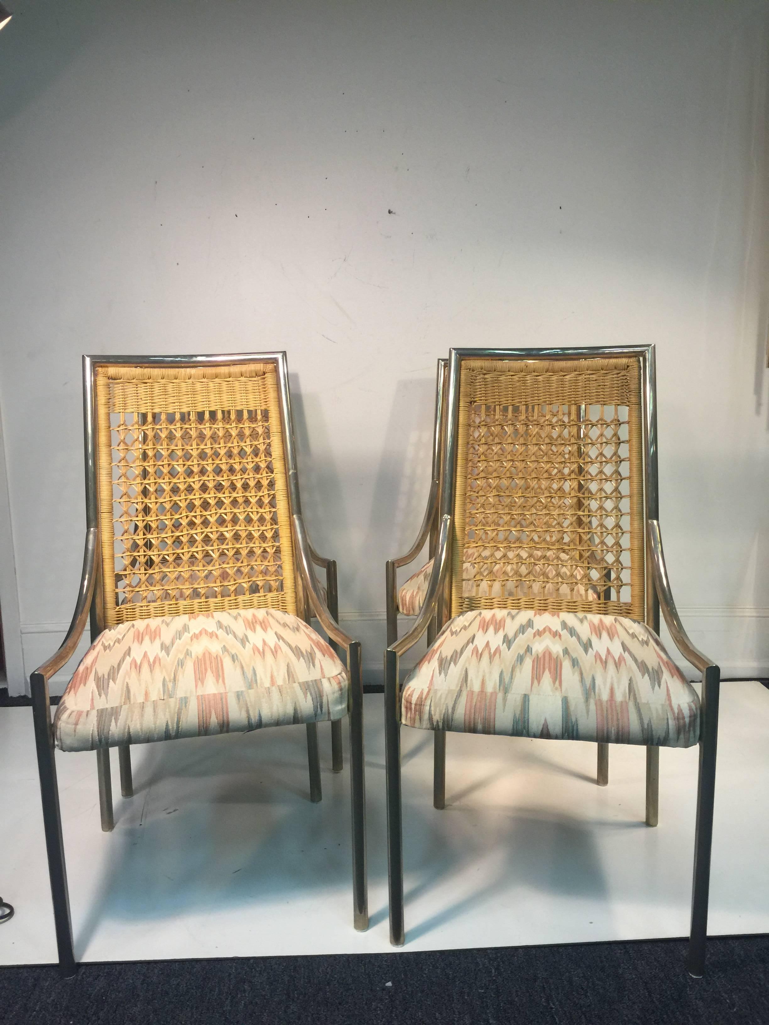 An elegant set of four rattan and chrome high back chairs with original fabric in the manner of Mastercraft, circa 1970. Good condition with age appropriate wear.