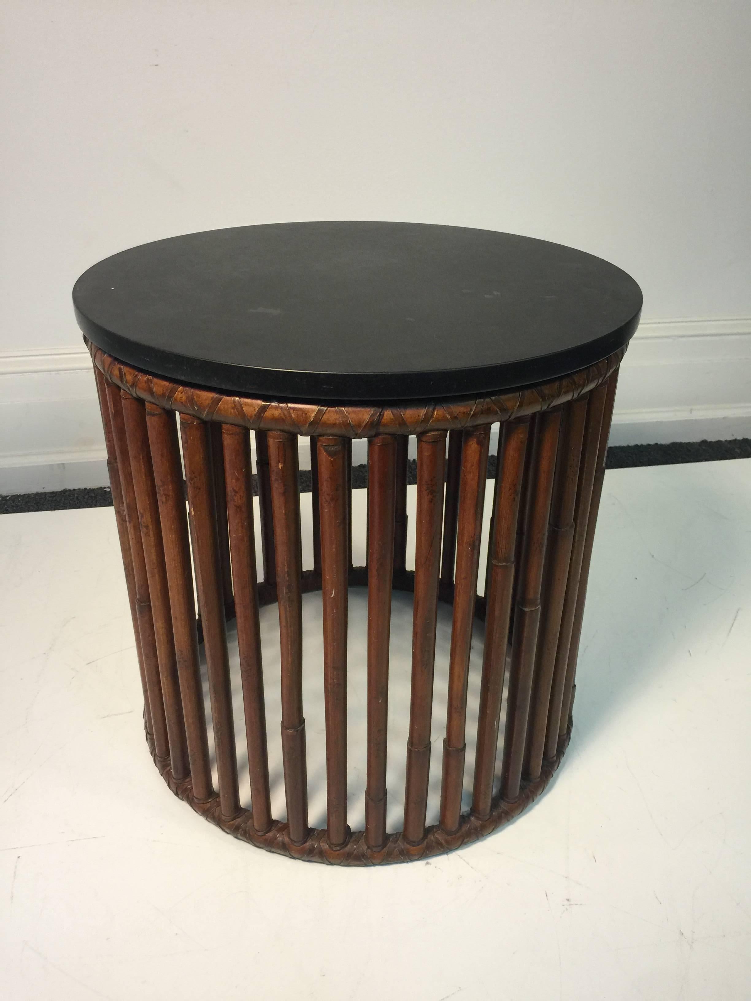 A beautiful bamboo drum table with granite top by McGuire, circa 1980. Good condition with age appropriate wear.