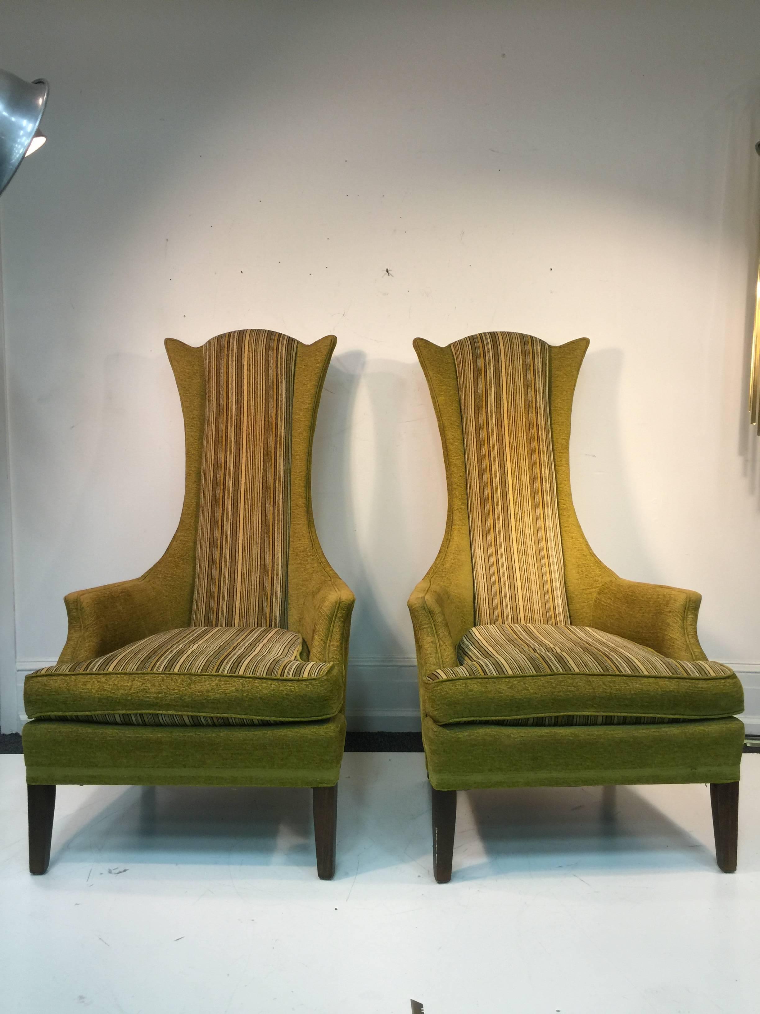 An unusual pair of high back armchairs in original moss or olive green upholstery with stripes by Adrian Pearsall, circa 1960. The design is inspired by Tommi Parzinger. Good vintage condition.