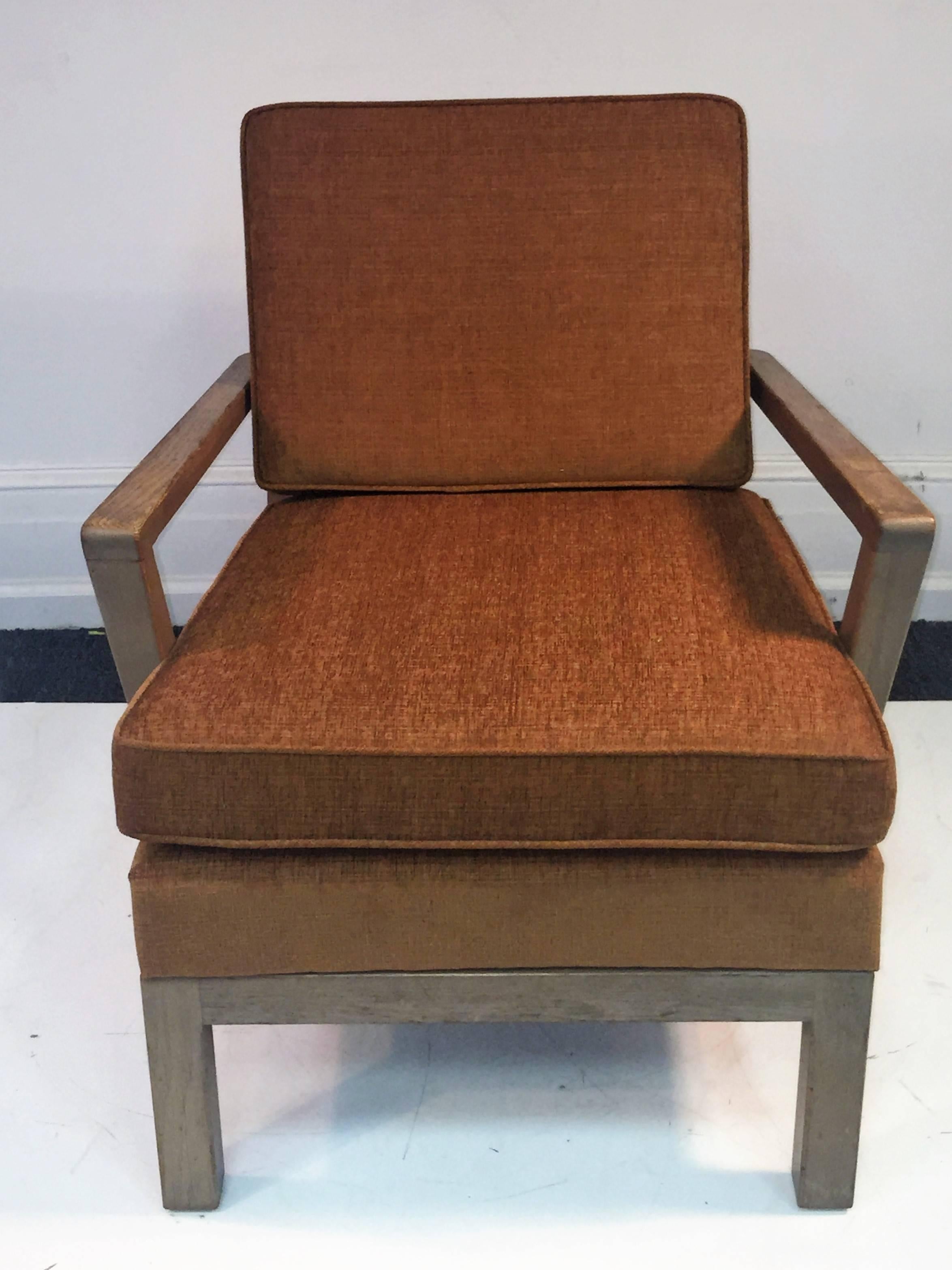 Great pair of modernist cerused oak armchairs in a great apricot fabric. In the style of Samuel Marx, these are a fine pair of chairs perfect for a high end living room. Measures: The width of the armless chair is 24”, the height is 28 1/2