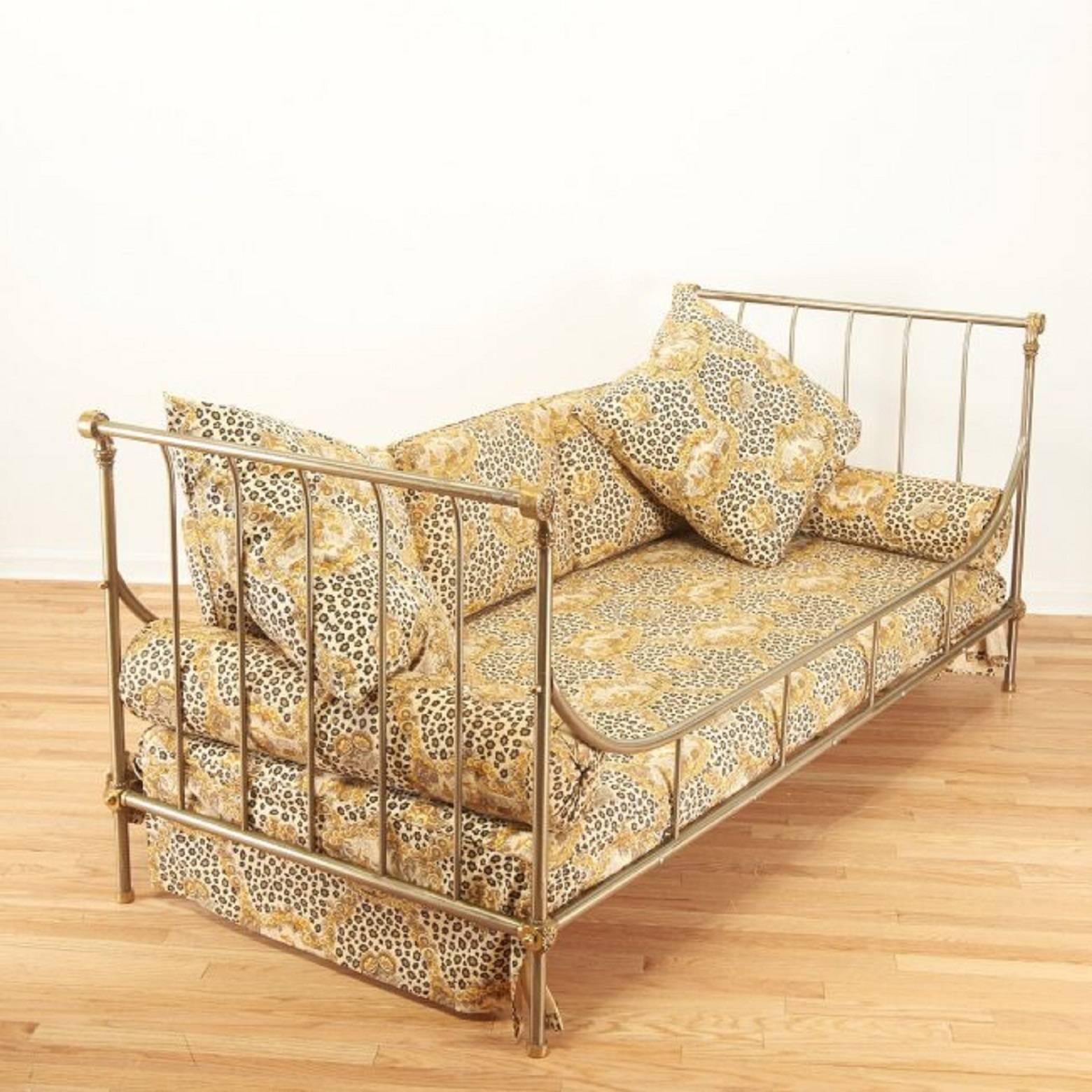 An exceptional steel and brass French daybed with beautiful upholstery and fine details by Maison Jansen, circa 1970. Good vintage condition with age appropriate patina.