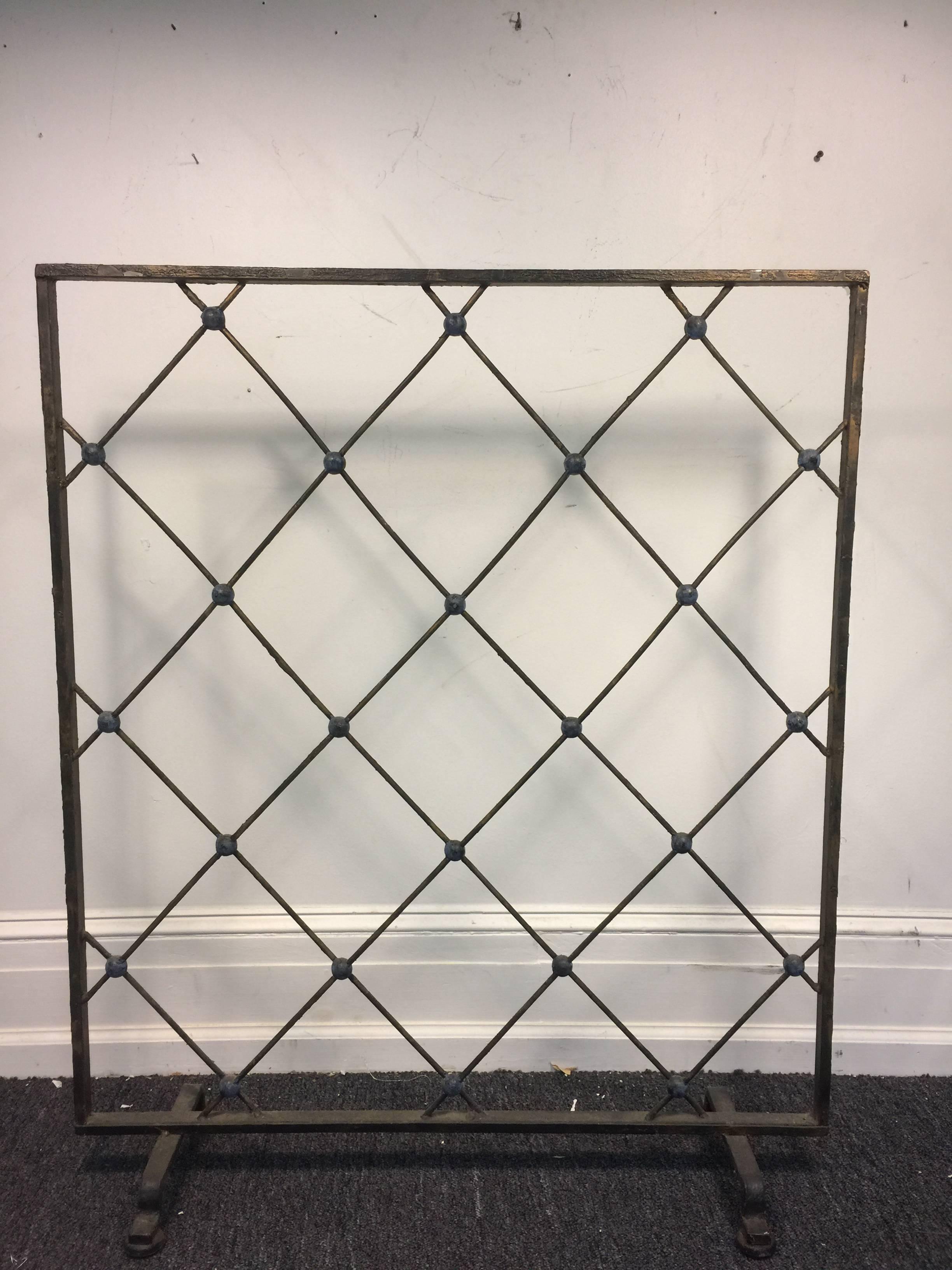 An incredible, lattice pattern iron screen, room divider, or sculpture in the manner of Jean Royère, circa 1950. Great for any modern setting.