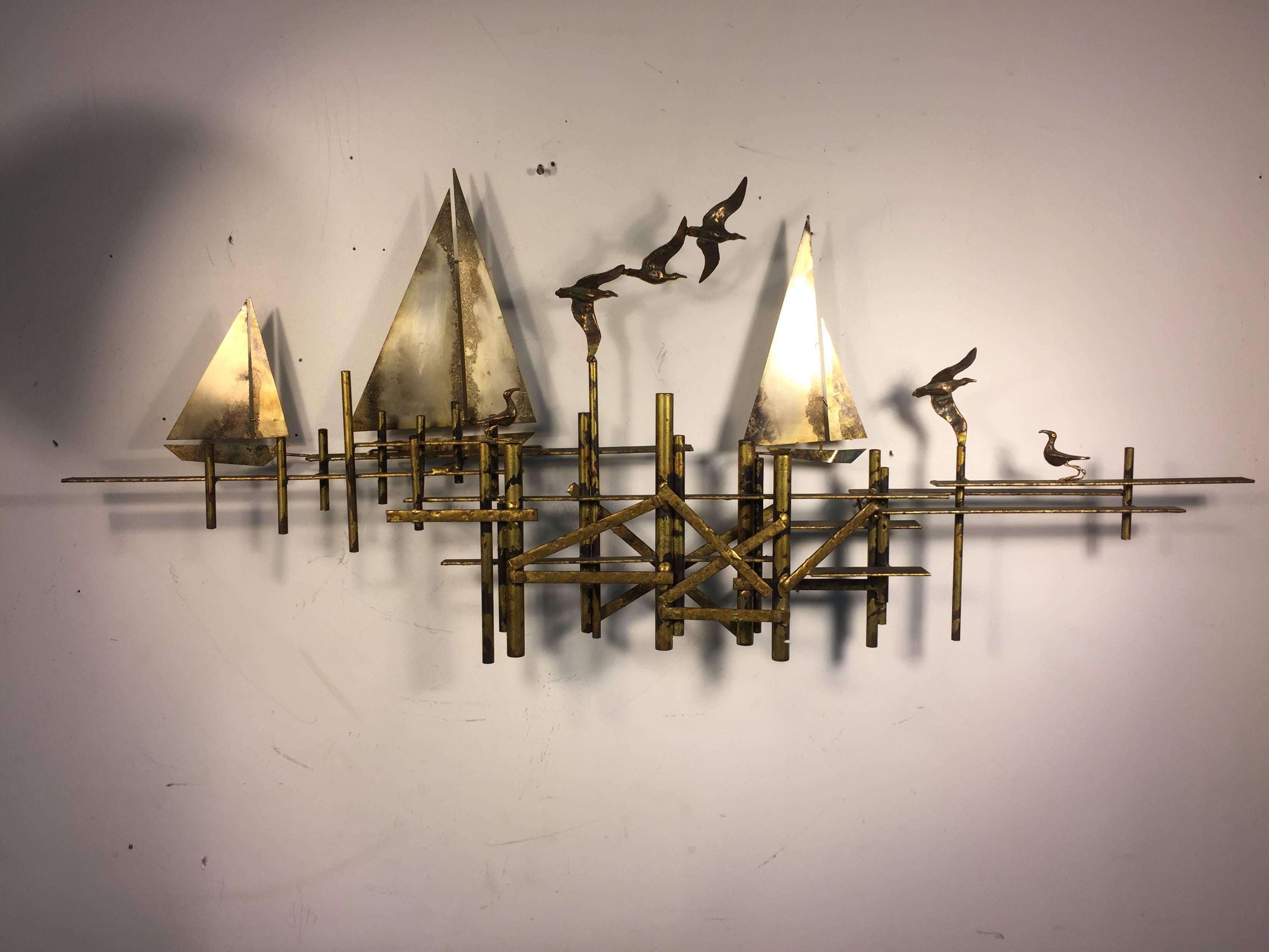 Fantastic Curtis Jere Brutalist mixed-metal, wall-mounted sculpture with birds in flight and sailboats. Signed, C. Jere and dated 1971. Good vintage condition with age appropriate patina.
