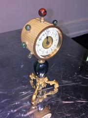 Glamorous Suite of Semiprecious Stone and Doré Bronze Clock and Candlesticks