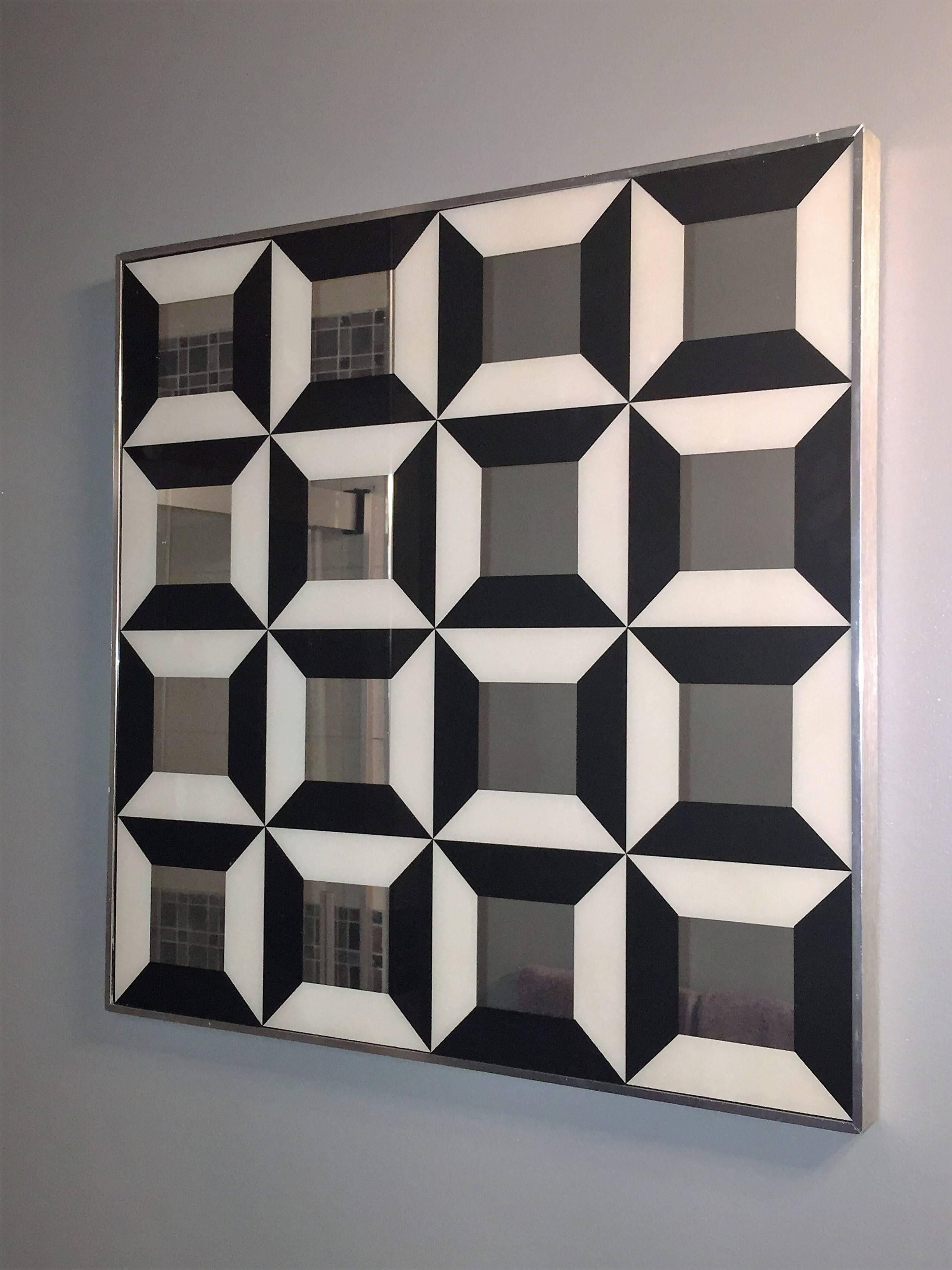 Mod 1970s black and white square repeating design optical mirror set in an brushed aluminum frame designed by Verner Panton.