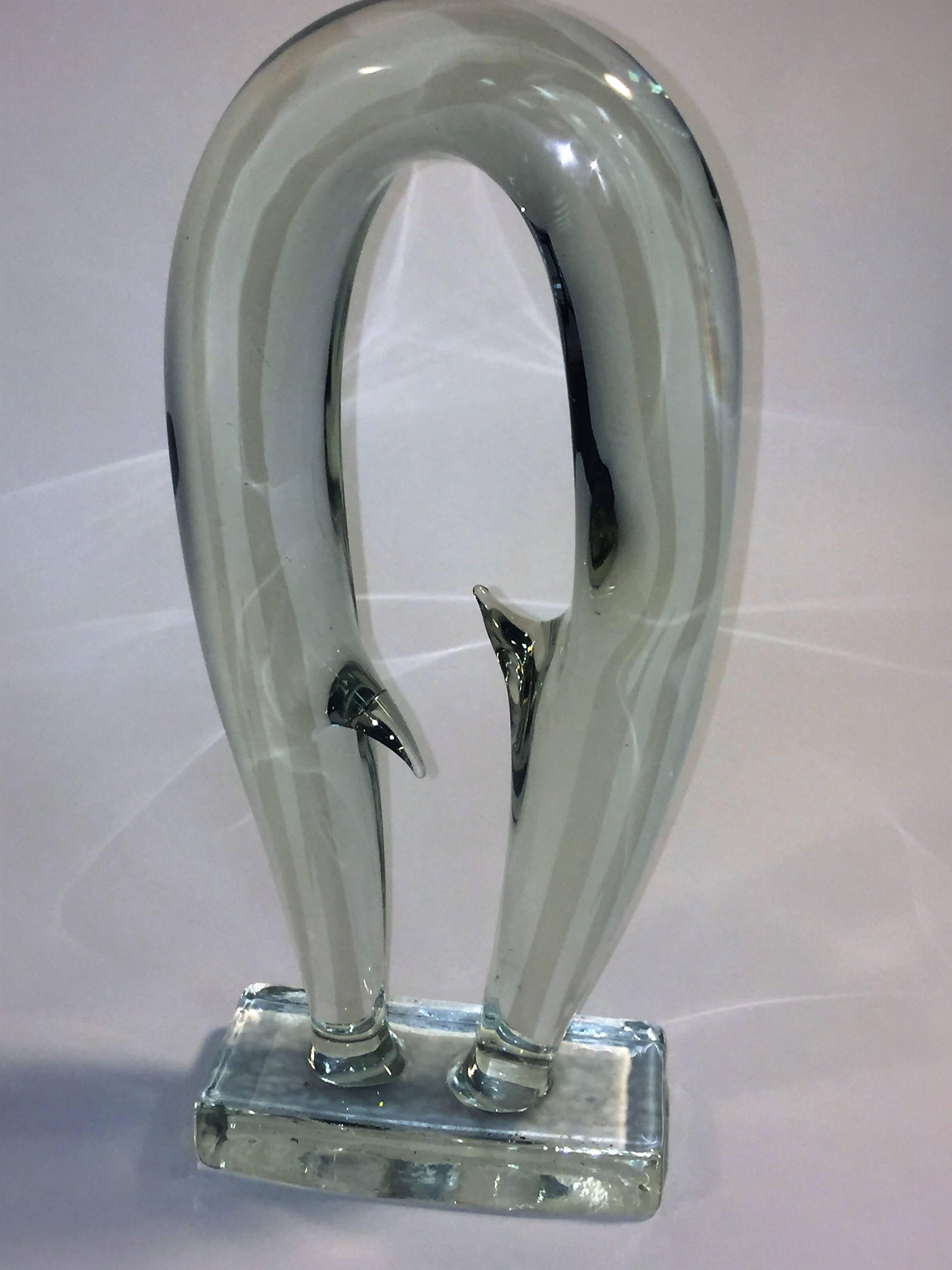 1970s curving form fluid clear Murano glass form by Seguso, interesting piece with two formed spike points. The rectangular base is 7