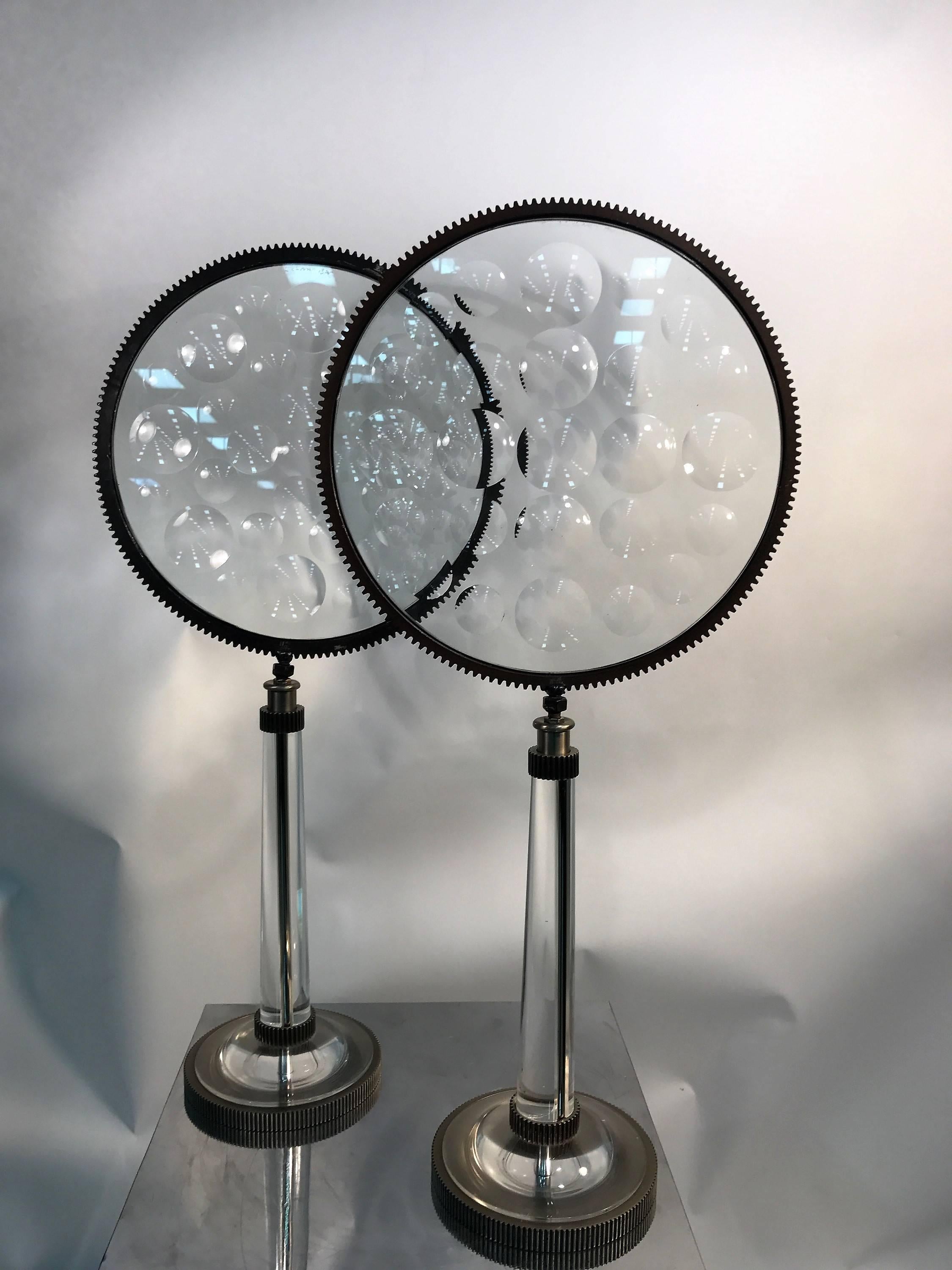 Unusual design with a clear Lucite base and stem mixed with the Industrial metal gears and great glass faces.