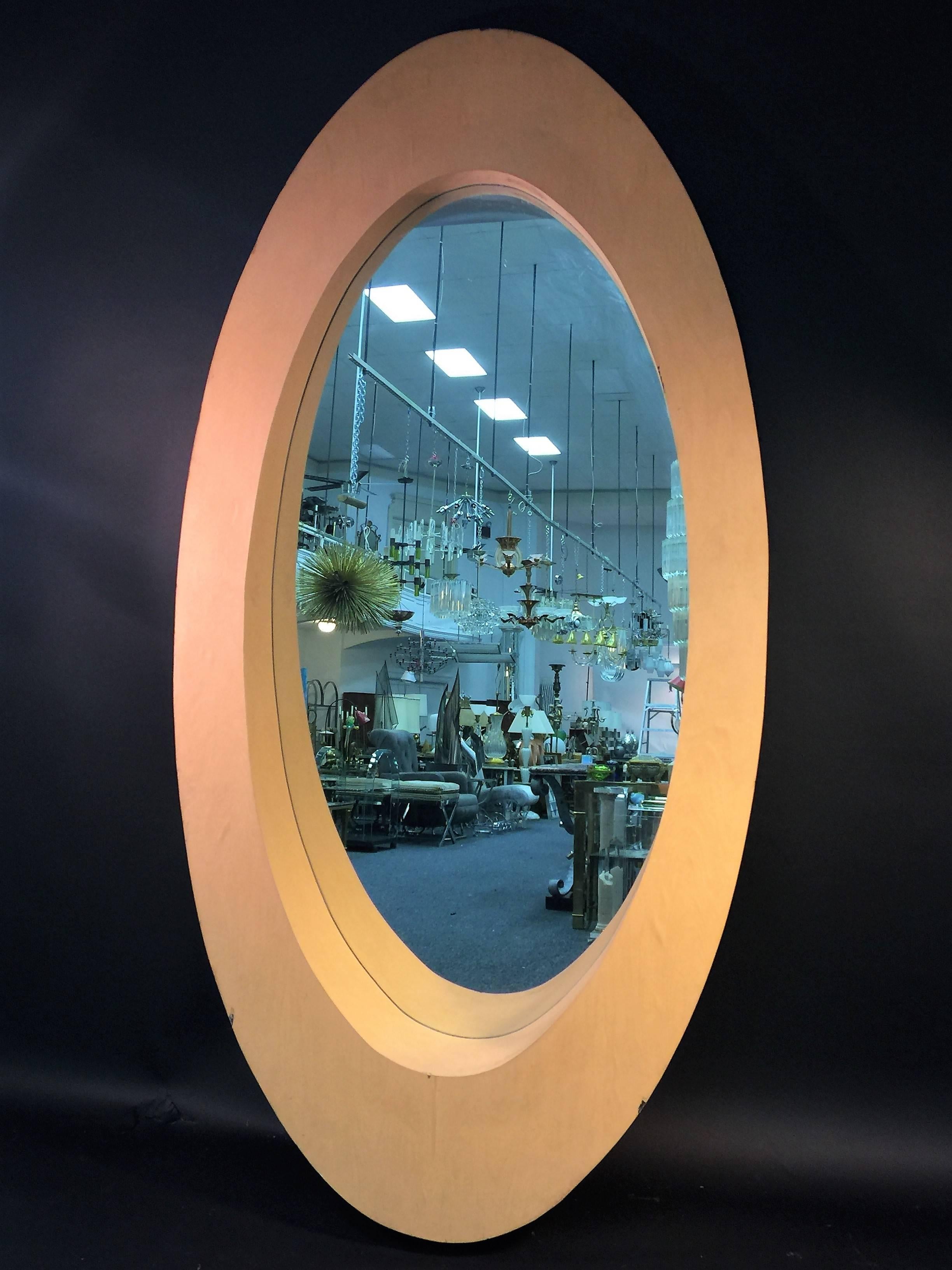 Great pair of mod wood mirrors in a ovoid shape tapering from thinner to wider. Incredibly well constructed and solid, these would be fantastic on a large wall with a great painting in the center and double consoles underneath. The top depth is 4
