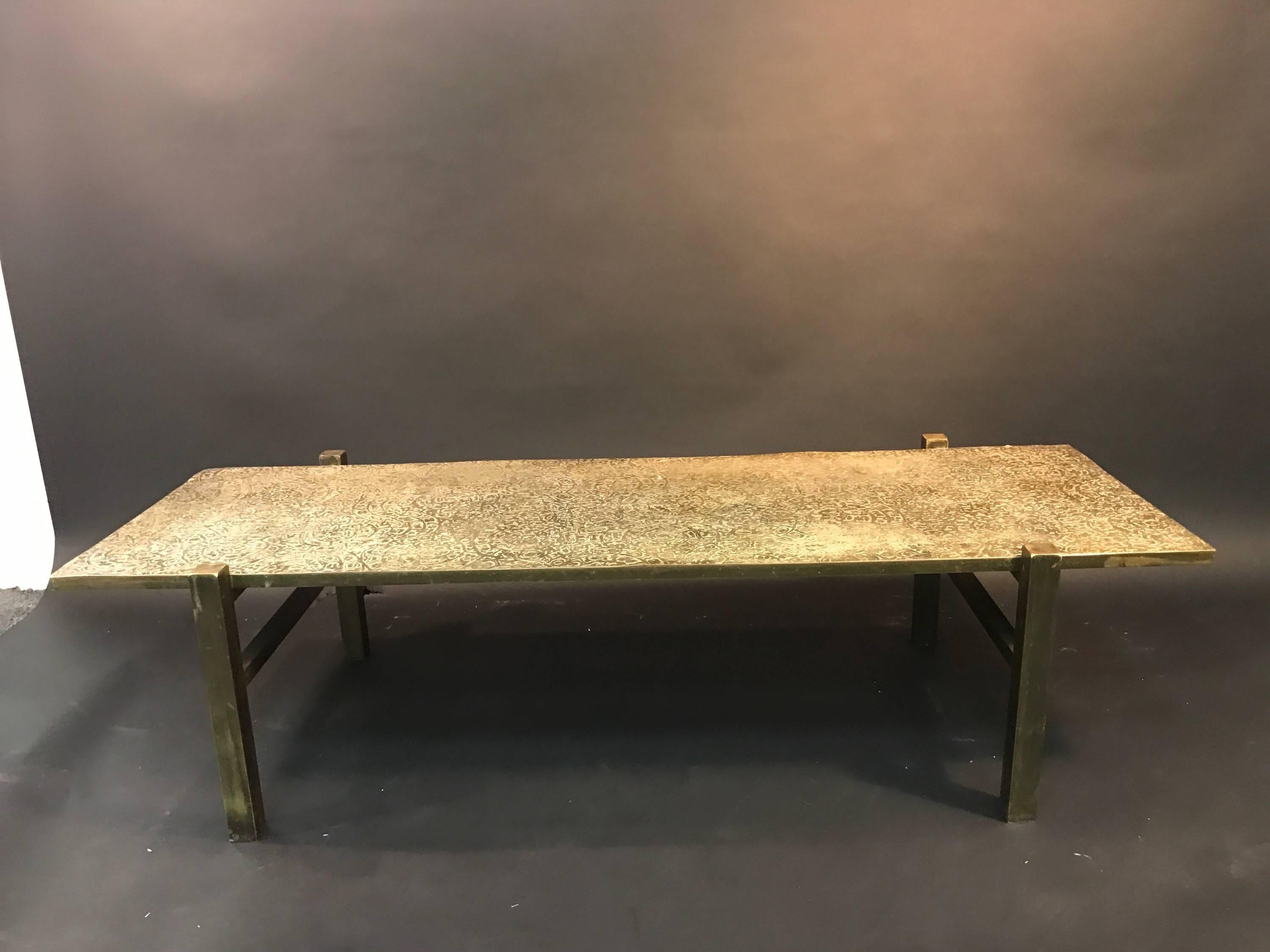 Beautiful rectangular coffee table with great bronze laminate mounted on wood table with an rare and early design by Philip and Kelvin LaVerne. Signed P K Laverne this is a piece that would suit many high end interiors.