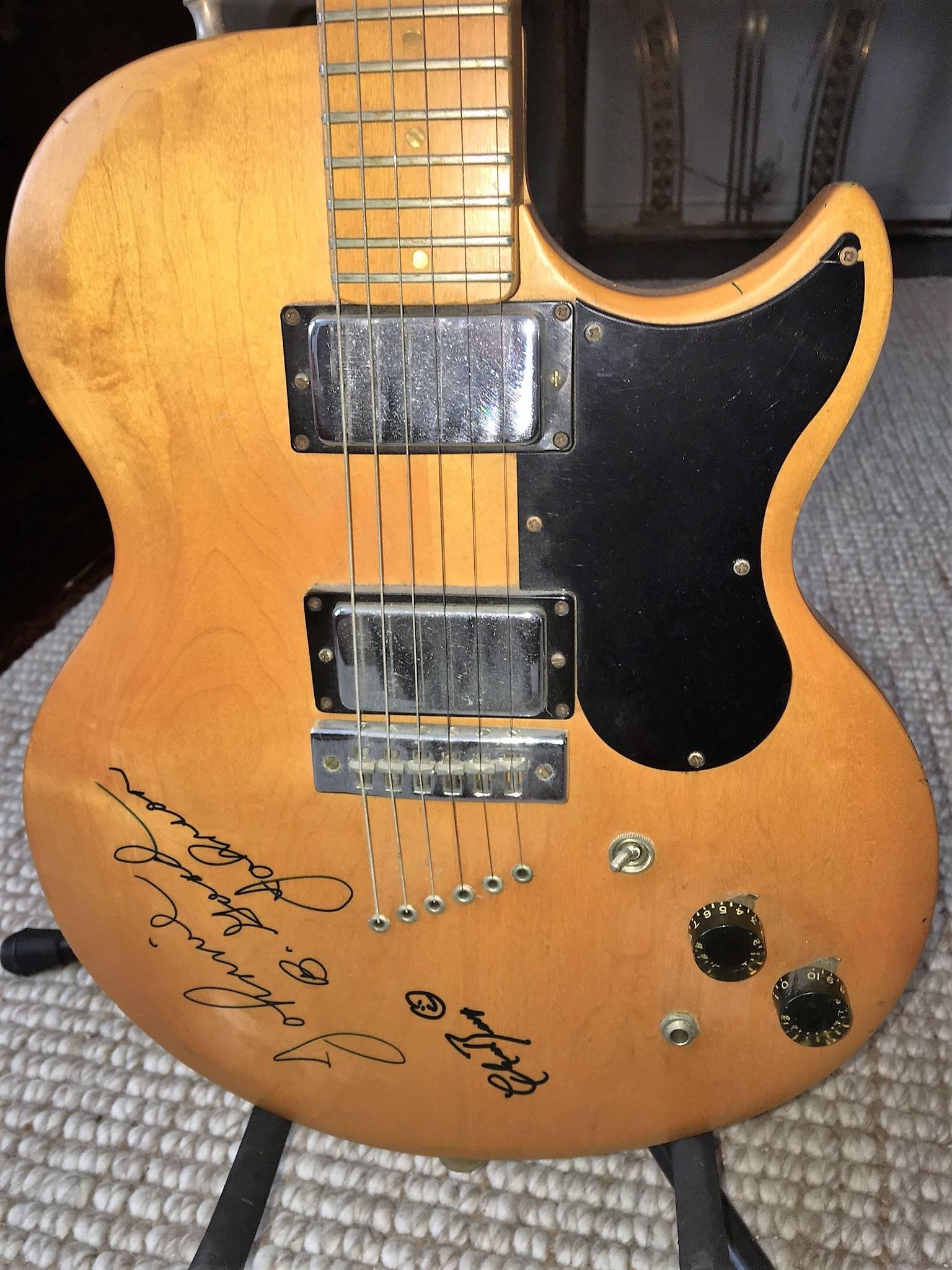 This Circa 1967 Gibson guitar is hand signed by guitar legend Chuck Berry who also created a Smiley face. Johnny B.Good Johnson Chuck Berry's Piano Player also autographed this guitar. All these autographs were obtained in person in 1994 by the
