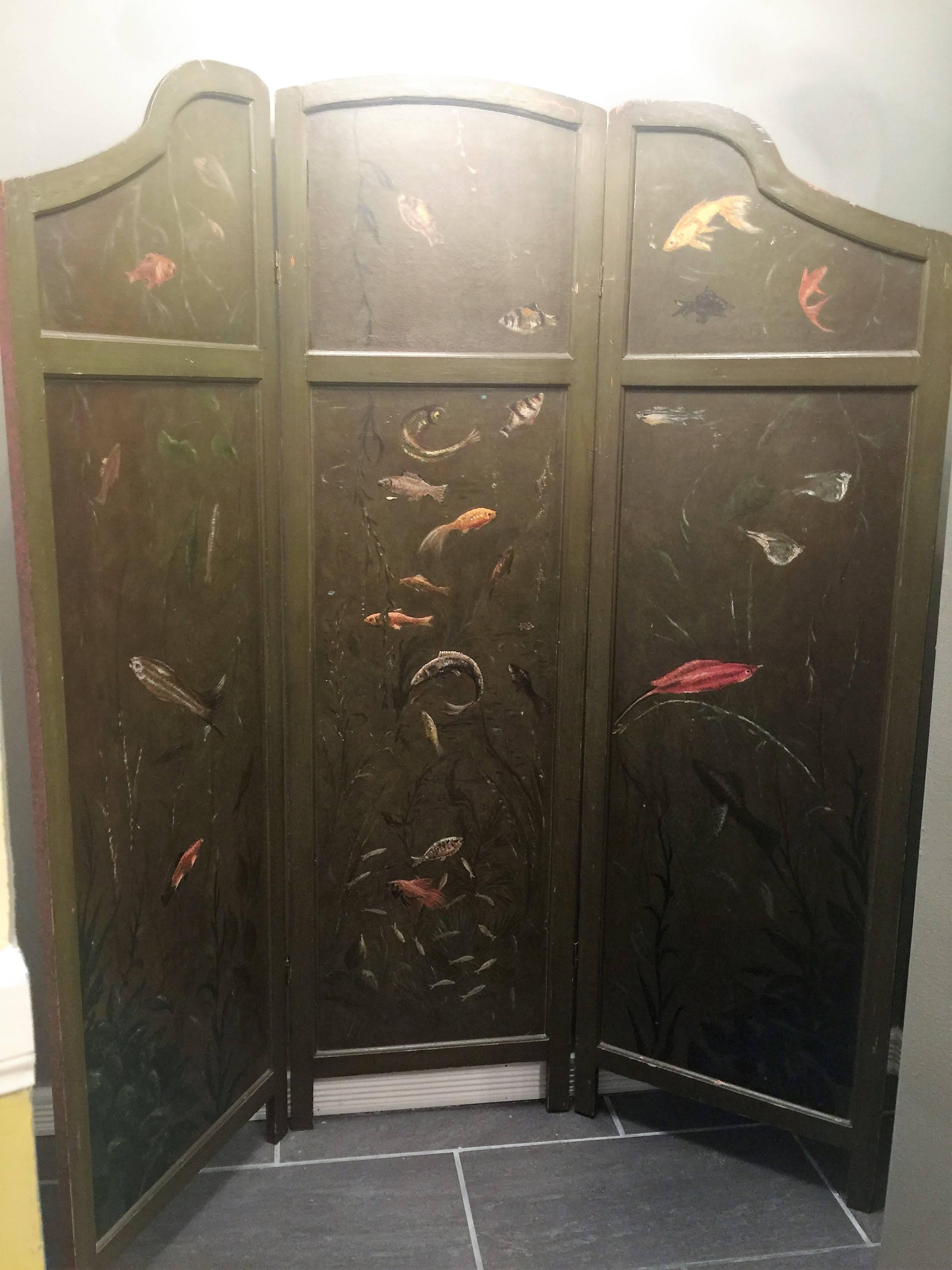 1940s hand-painted three wood panel room screen with olive green background of underwater exotic fish scenes, nicely detailed with fan tailed goldfishes, Siamese fighting fish and many other species. The other bright red side has intricate Asian