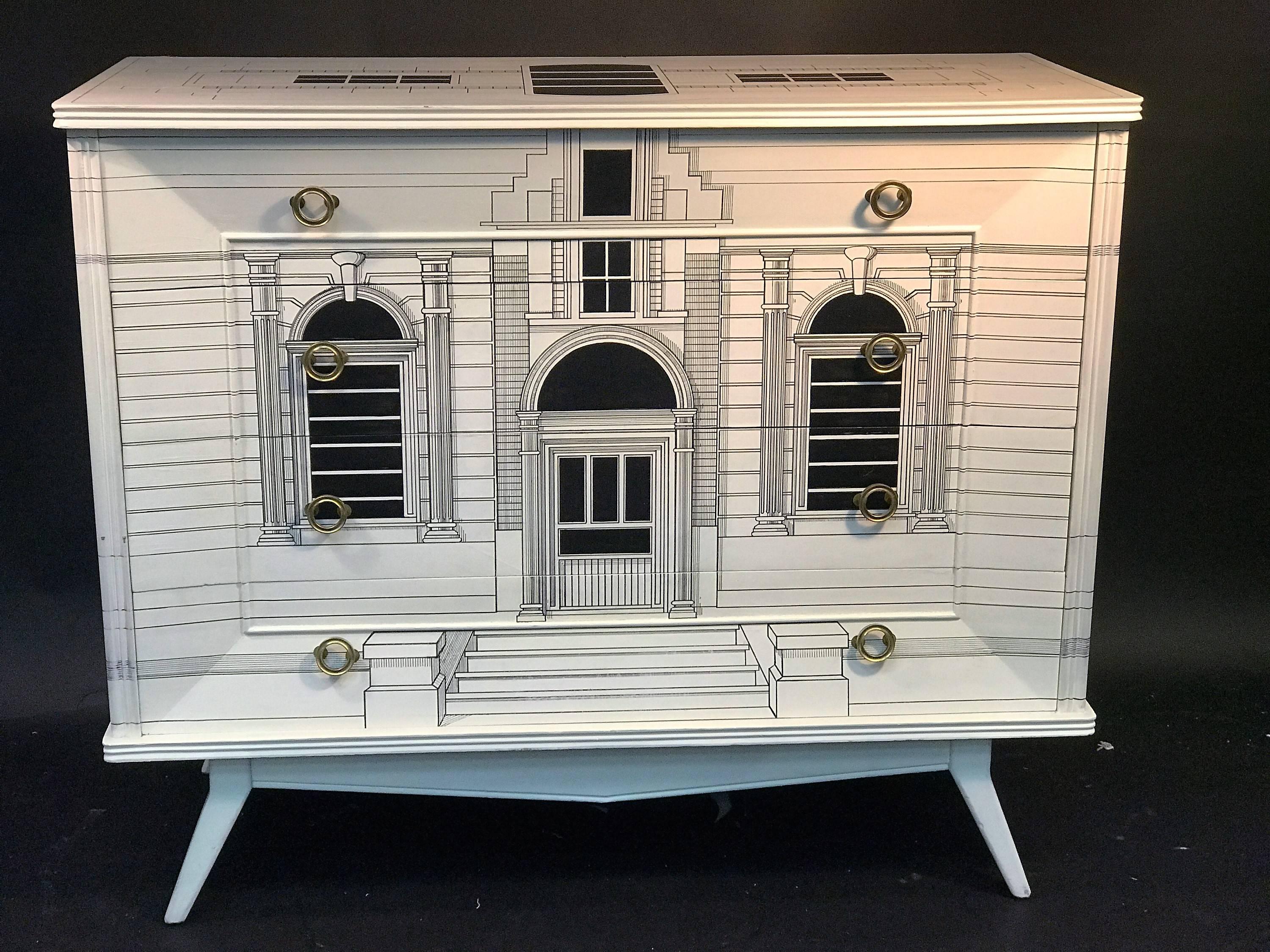 1960s-1970s great graphic black and white chest of drawers decorated with beautiful neoclassical building. Four drawer dresser with high end brass circular design handles complete this piece. In the manner of Piero Fornasetti this piece has all the