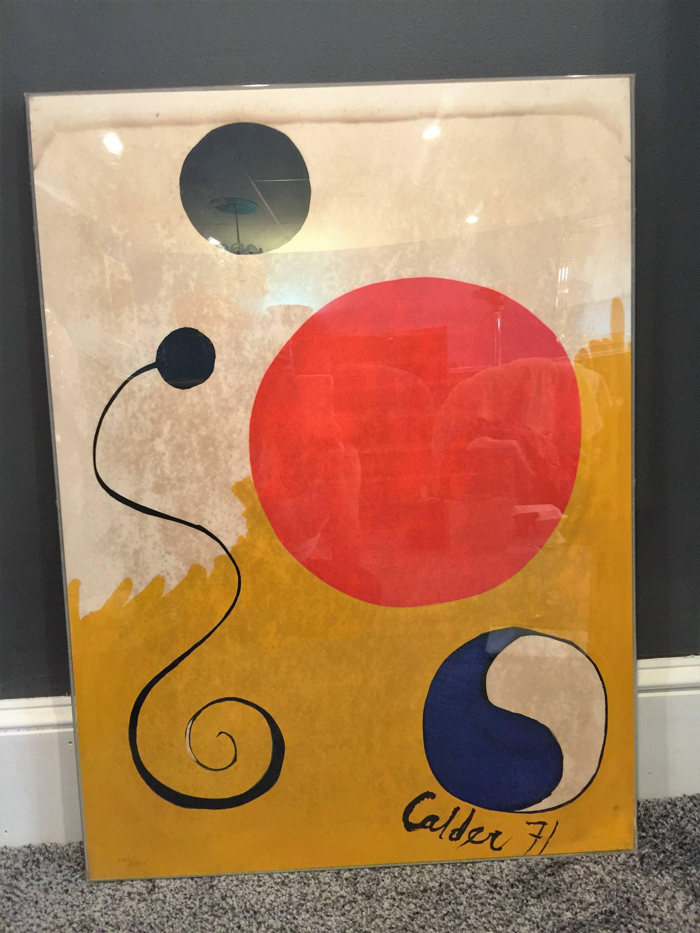 Yellow, blue, red and black on white Ying Yang modern lithograph by Calder Dated 71. Numbered 240/500 in pencil. Encased in a clear Lucite frame. The one problem is there is mold on the lithograph as shown in the photos.