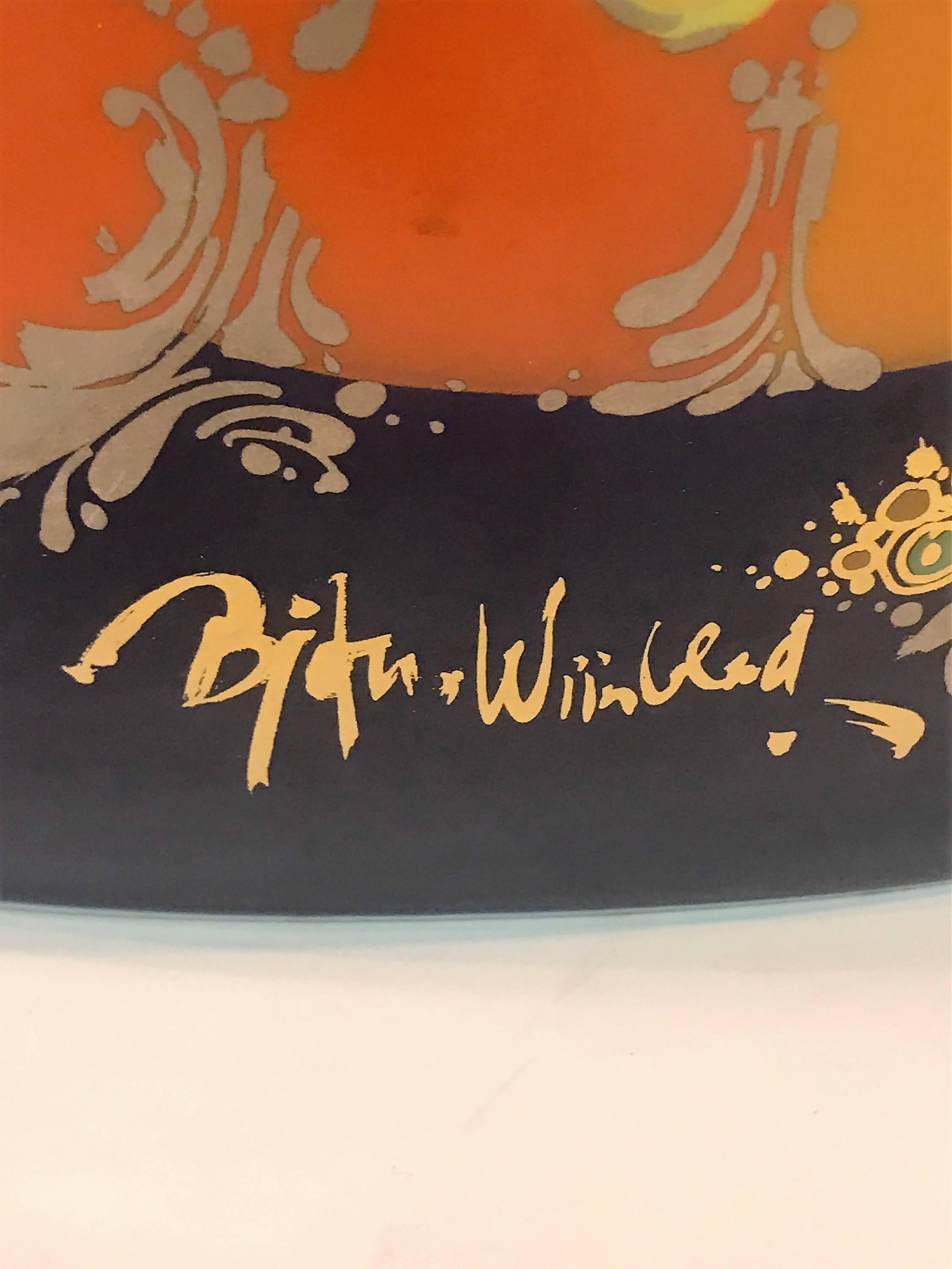 Colorful and beautiful Aladdin Motif Genie on Horse design Large Modernist porcelain Vase designed by Danish Artist Bjørn Wiinblad. Great graphic design decorated frontally and back against a cobalt blue background signed bjorn wiinblad in gold.
