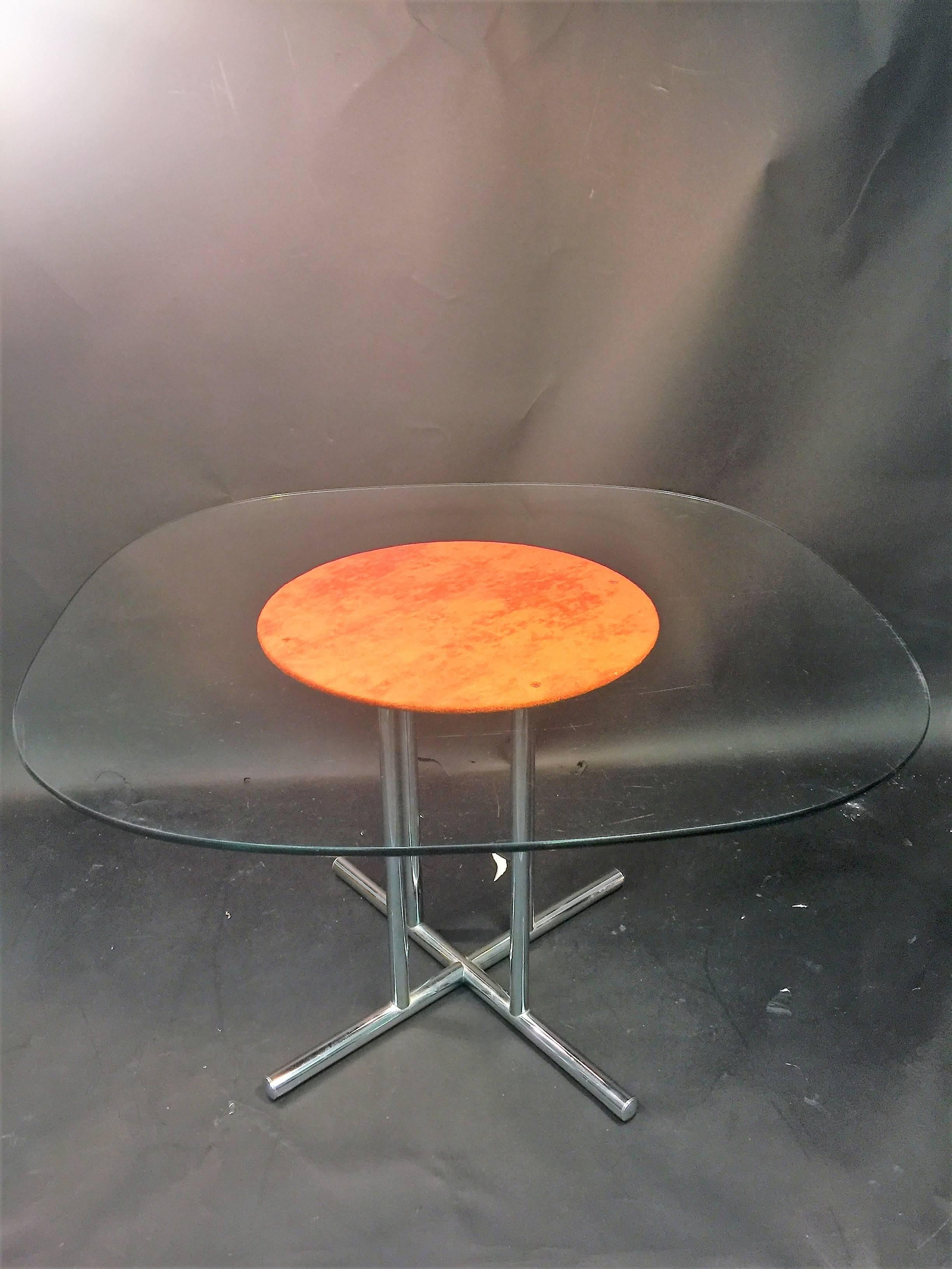 1970s beautiful original burnt orange velour ultra suede upholstered four dining chairs that swivel and are on beautiful chrome ball caster wheels. Great modernist tubular chrome design X-base dining table with the fabric circle inset design enhance