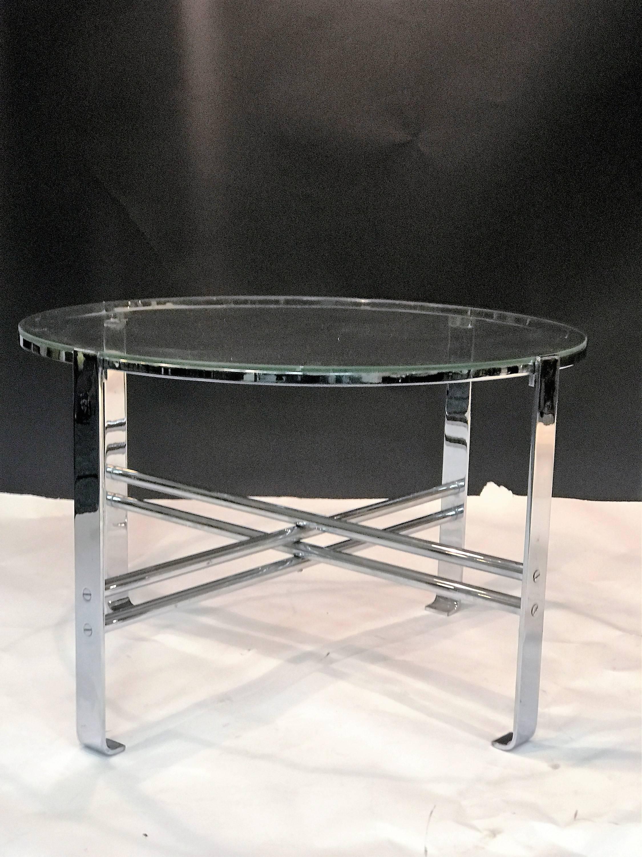 Great chrome metal flat band and tubular metal art deco table designed by modernist master Wolfgang Hoffman in the 1930s. Fantastic iconic design with the original glass top.
