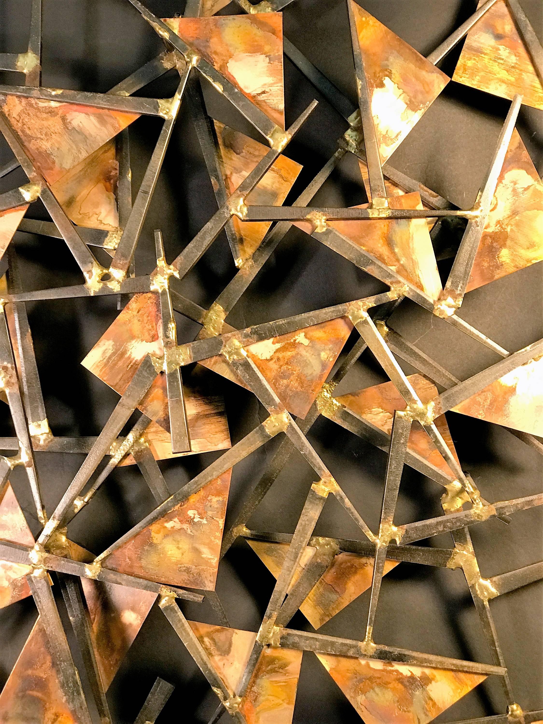 Great abstract form of triangle and nail design metals in tones of dark bronze and copper.