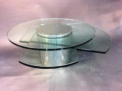 Substantial Karl Springer Style Revolving Nickel And Glass Coffee Table