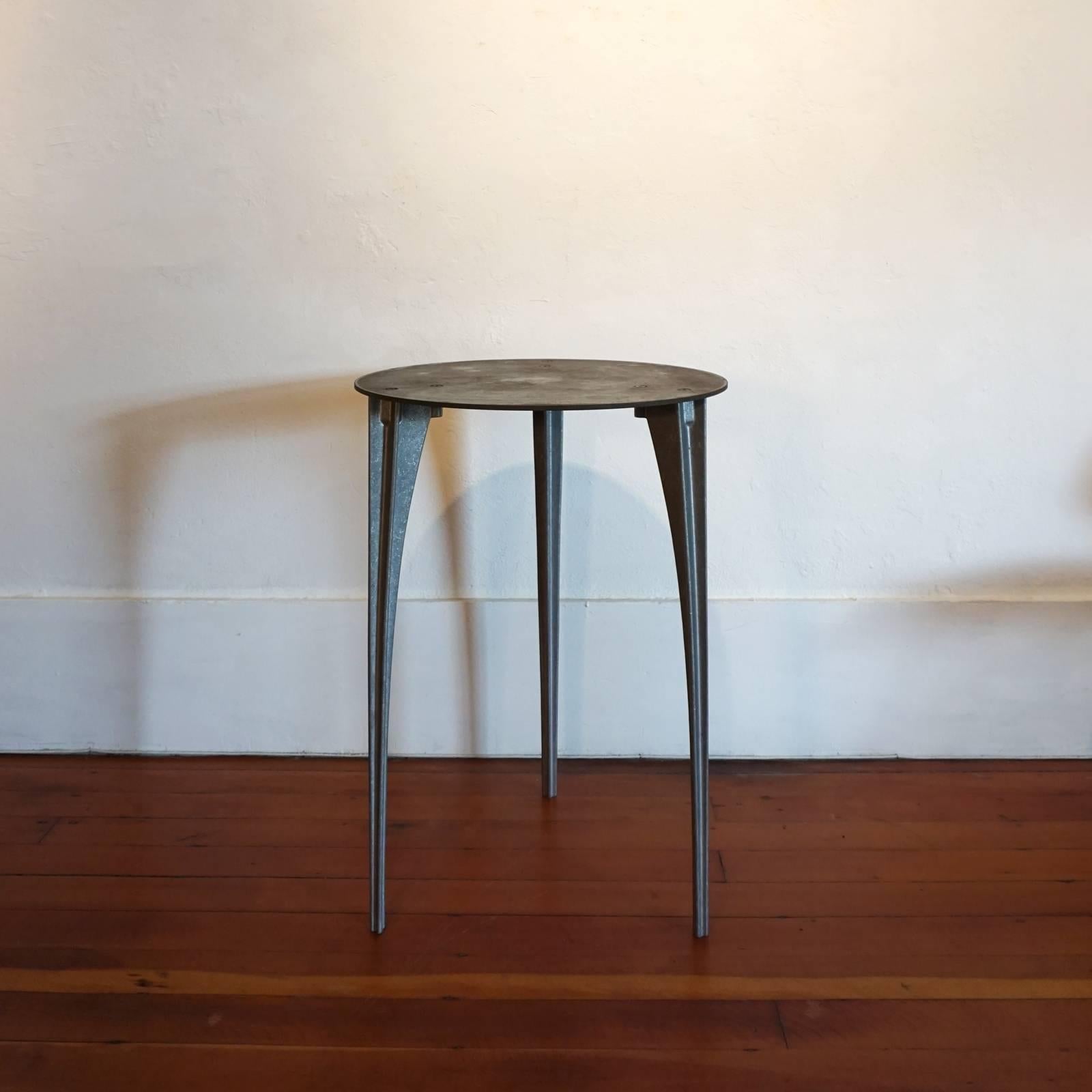 Aluminum legs with steel top pedestal or cocktail table by California designer, Robert Josten.