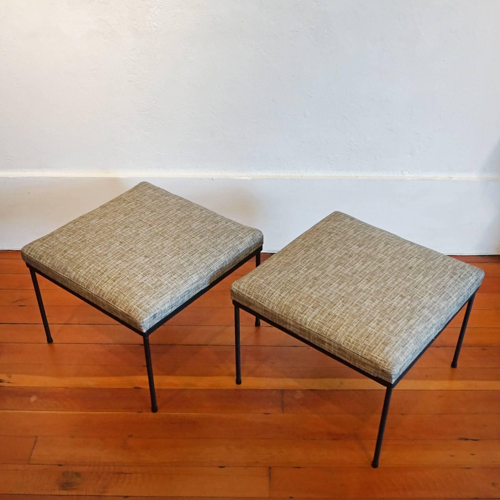 A pair of upholstered iron stools from the 1950s.