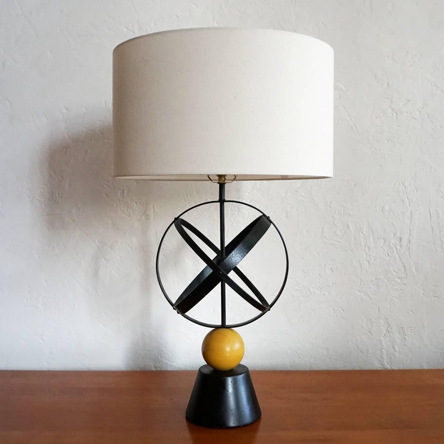 1950s lamp with metal bands and wood ball.