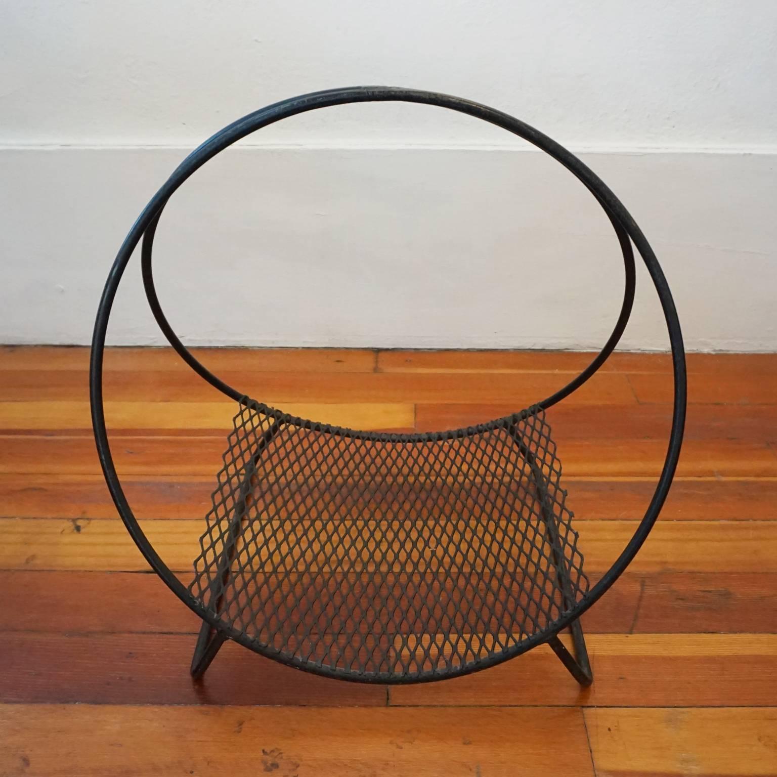 1950s iron and expanded metal hoop log or magazine holder.