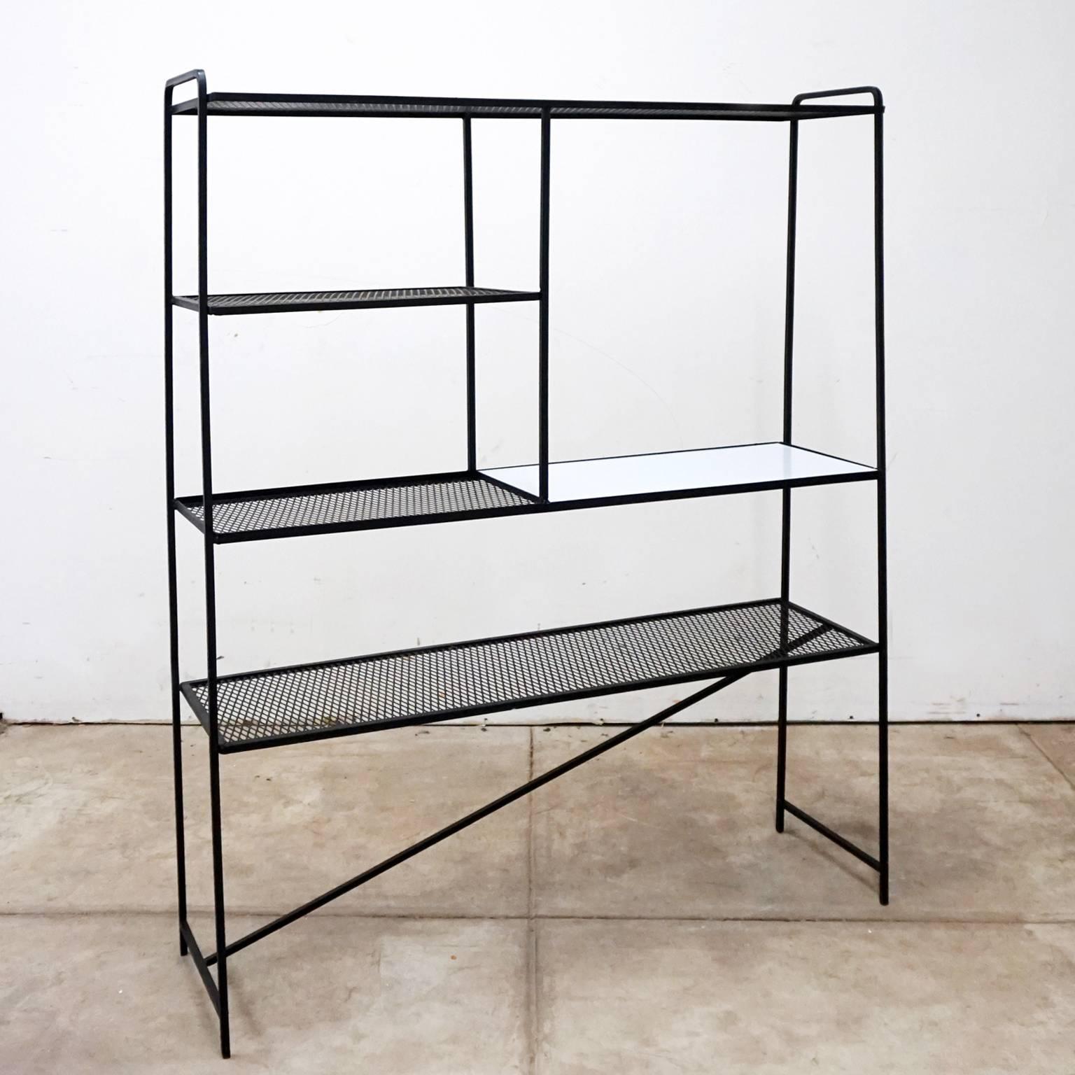 Iron room dividers or shelves by Freda Diamond (1905-1998). Solid square iron with expanded metal shelves and a single laminate over wood section.

Winner of multiple MoMA "Good Design" awards, the New York designer attended Cooper Union