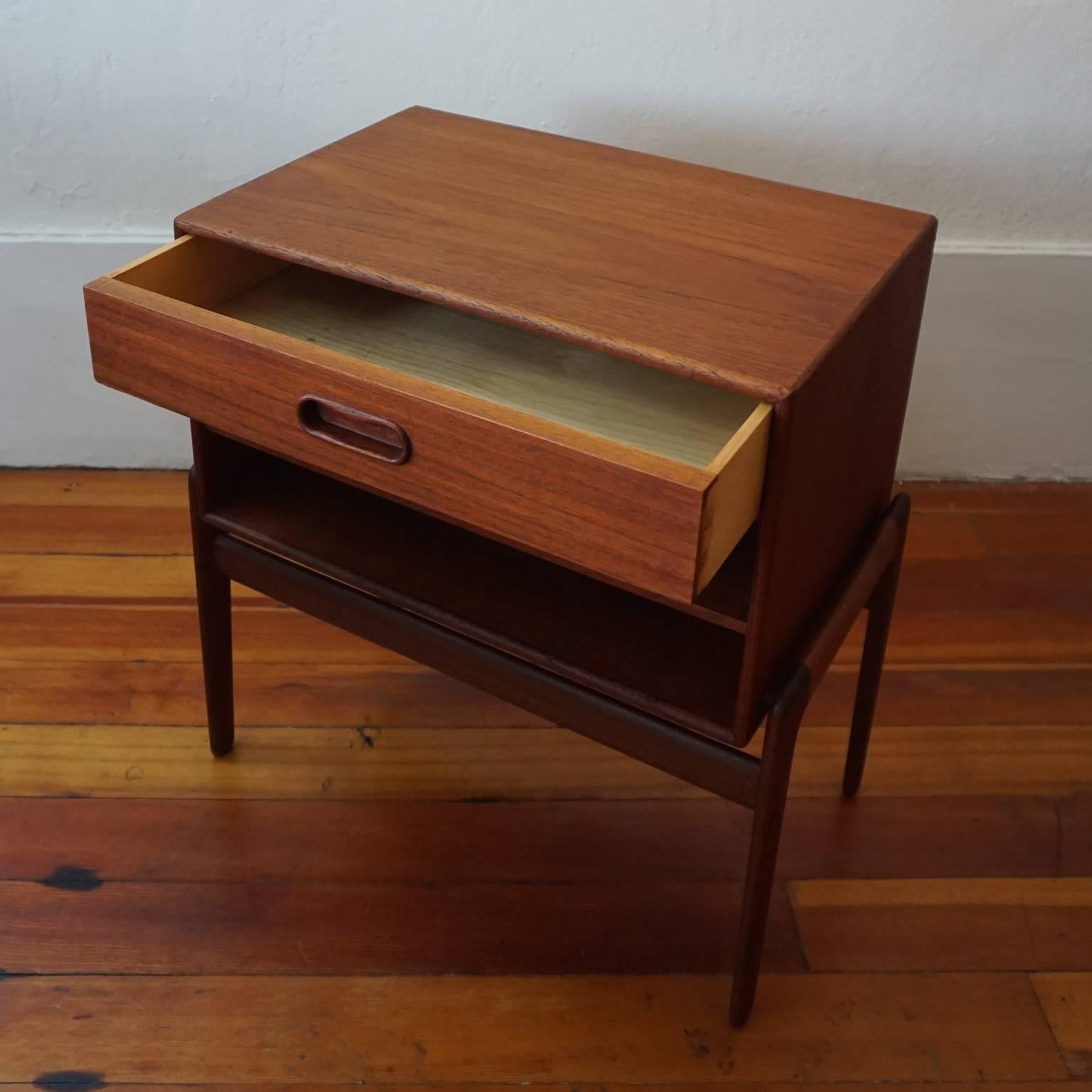 Teak end table or nightstand by Arne Vodder for Vamo Sønderbor. One drawer and two shelves. Brass screws. Made in Denmark, 1950s.