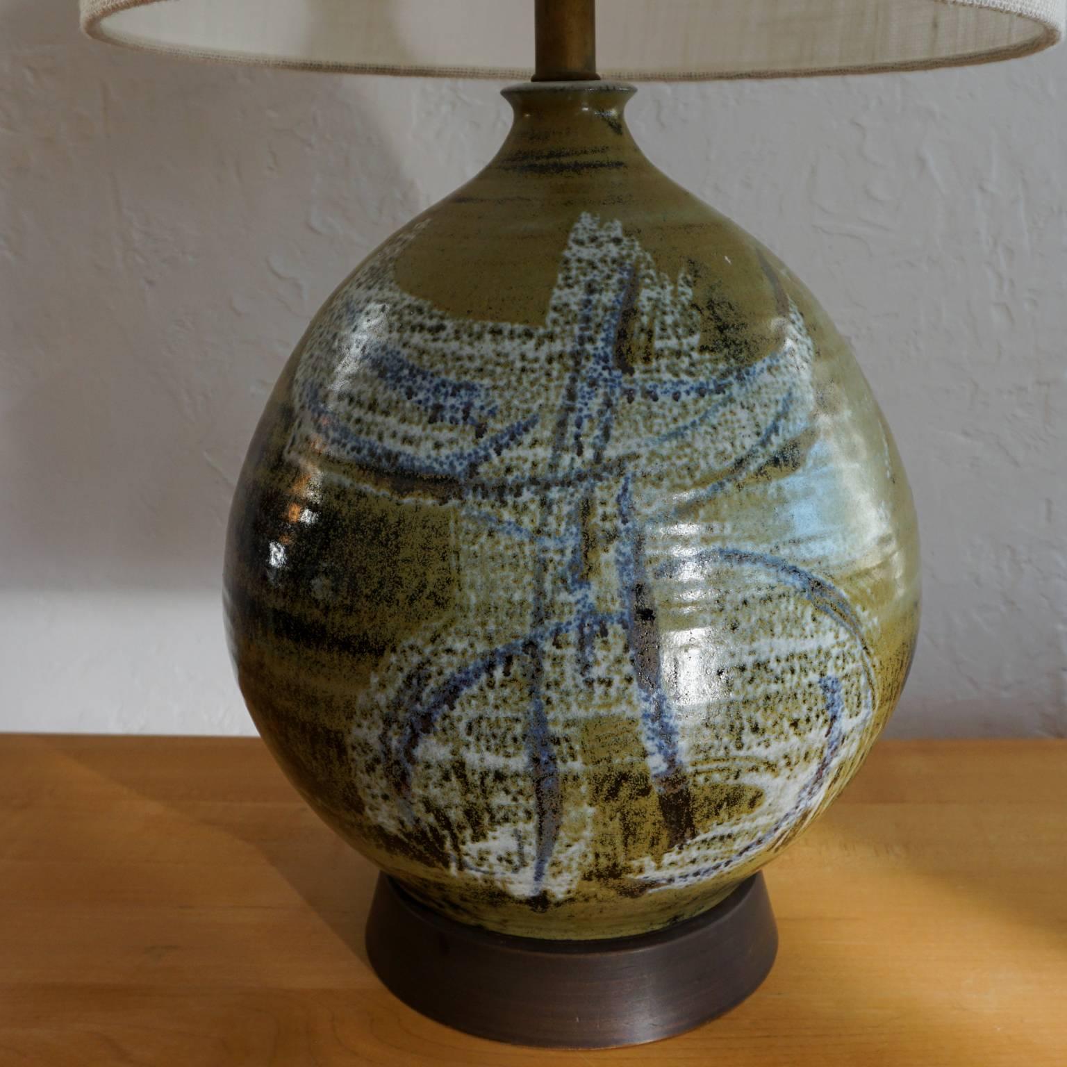 1960s hand-thrown glazed pottery lamp by California ceramic artist, Joel Edwards. Signed in the clay. 

Joel Edwards, Los Angeles, CA. Studied at Otis Art Institute under Peter Voulkos. Creator of “Creative Crafts” magazine, 1960-1964.
