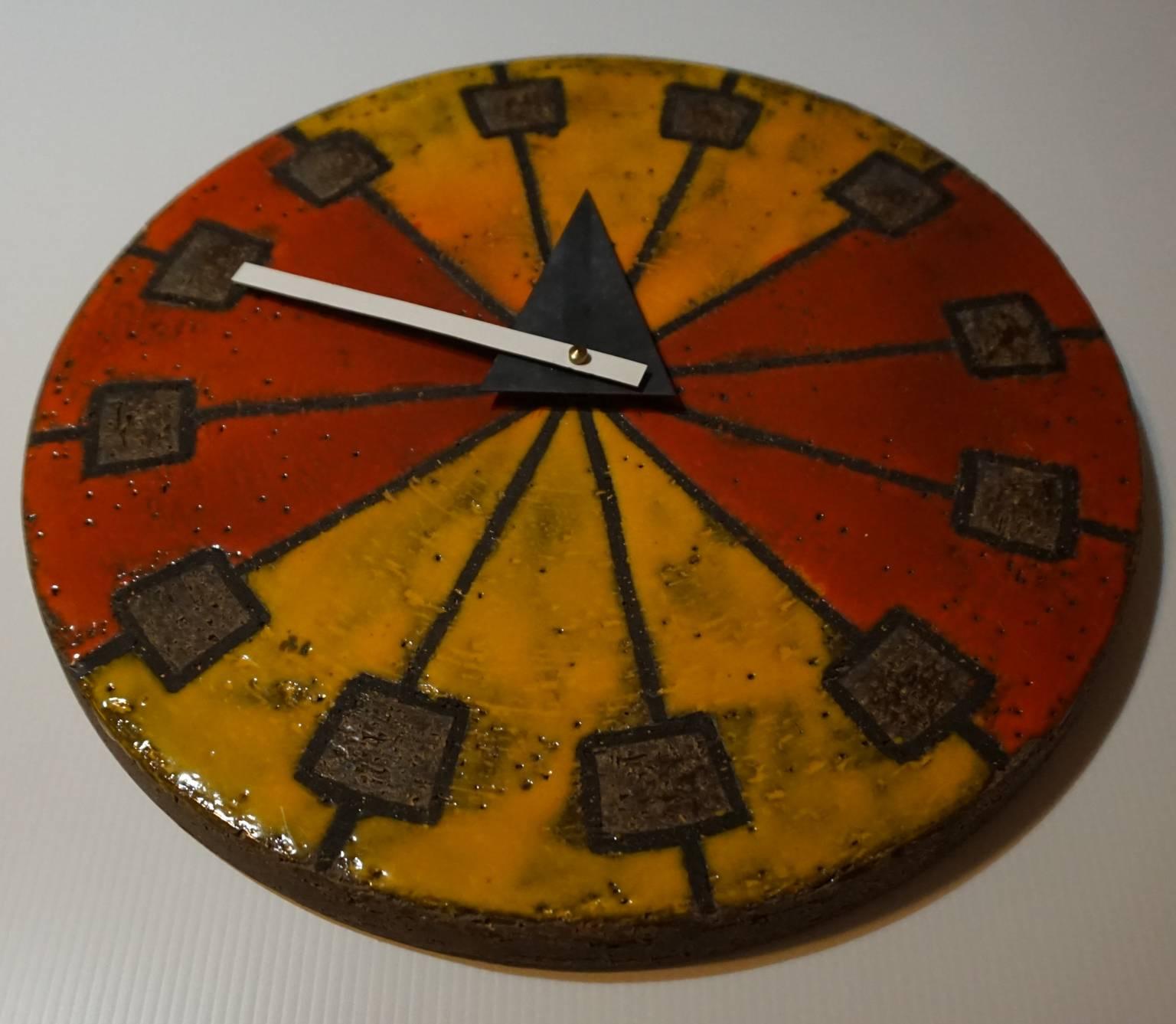 Ceramic wall clock from Howard Miller's Merdian line, from 1964. As stated in the Howard Miller catalog, the handcrafted clock was a collaboration between artists and the clock company.

Original hands, with a new and quiet USA made battery