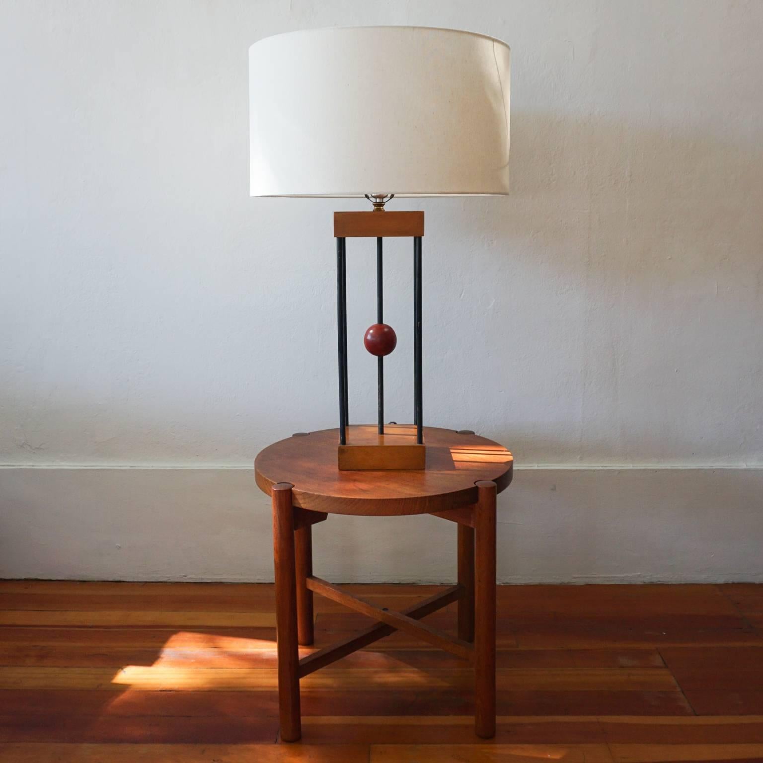 Wood and iron lamp by Albert Blake. Architectural and simple design with modest materials from the early 1950s. 

After serving in the Army, Blake moved from the midwest to California and worked as a scene designer. He then moved into full-time