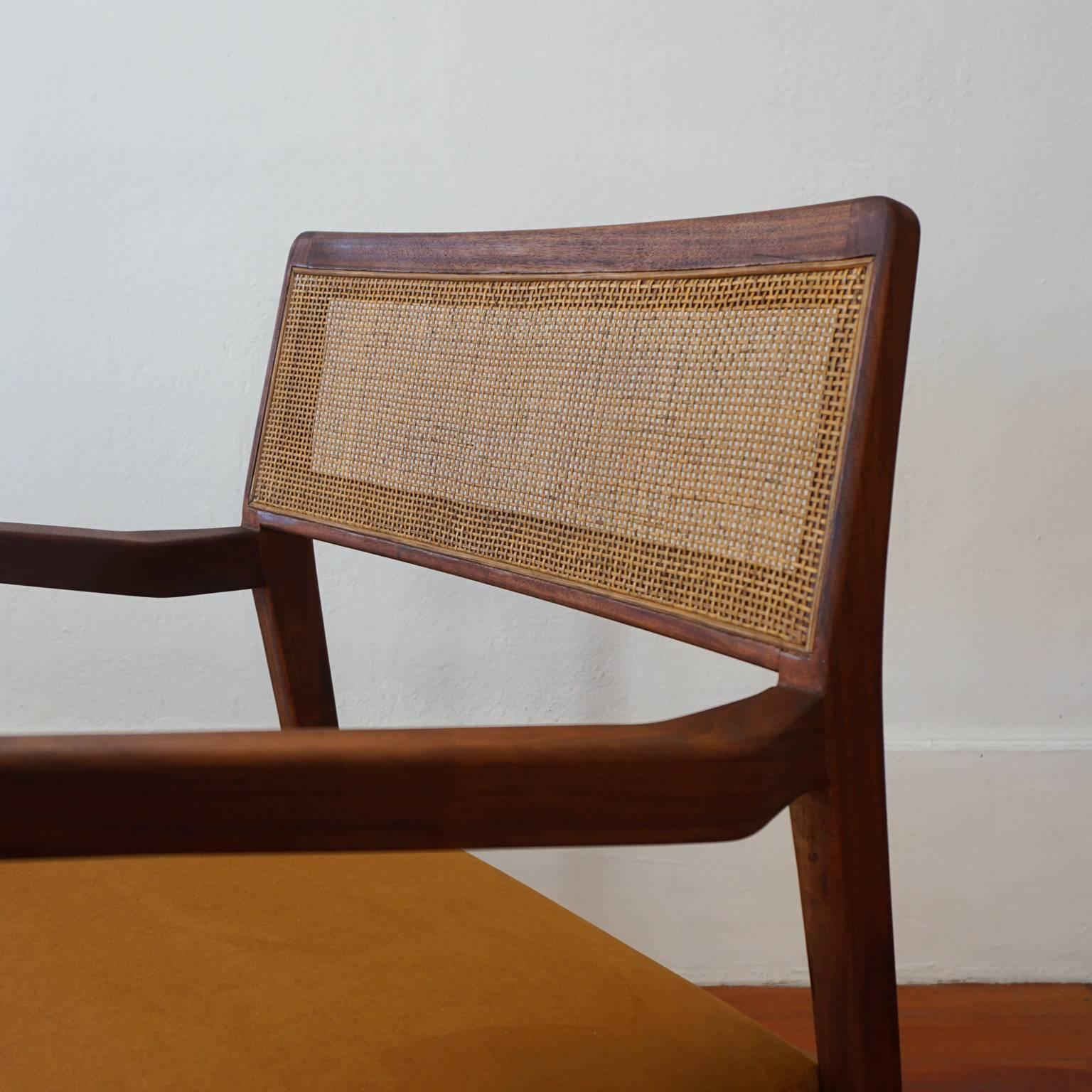 Oiled Pair of Jens Risom Walnut Cane Back Armchairs