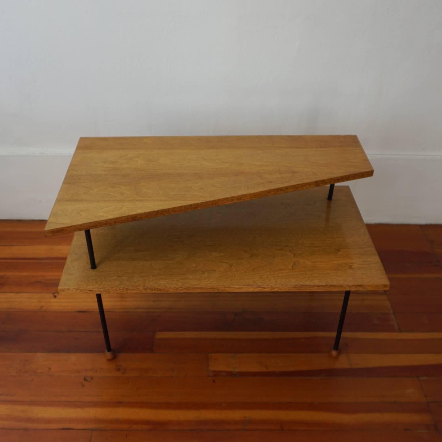 Asymmetrical two-tier occasional table with iron legs and ball feet. Designed by Swedish-born California designer, Greta Grossman, 1952.