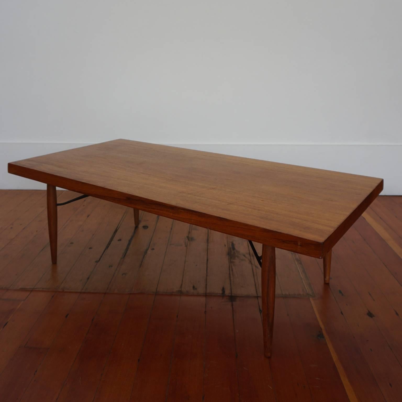 1950s iron and mahogany table by Luther Conover, with original finish.

Conover was based in the San Francisco Bay Area. His furniture was produced in his workshop in very limited numbers. It was marketed through the short-lived Post War