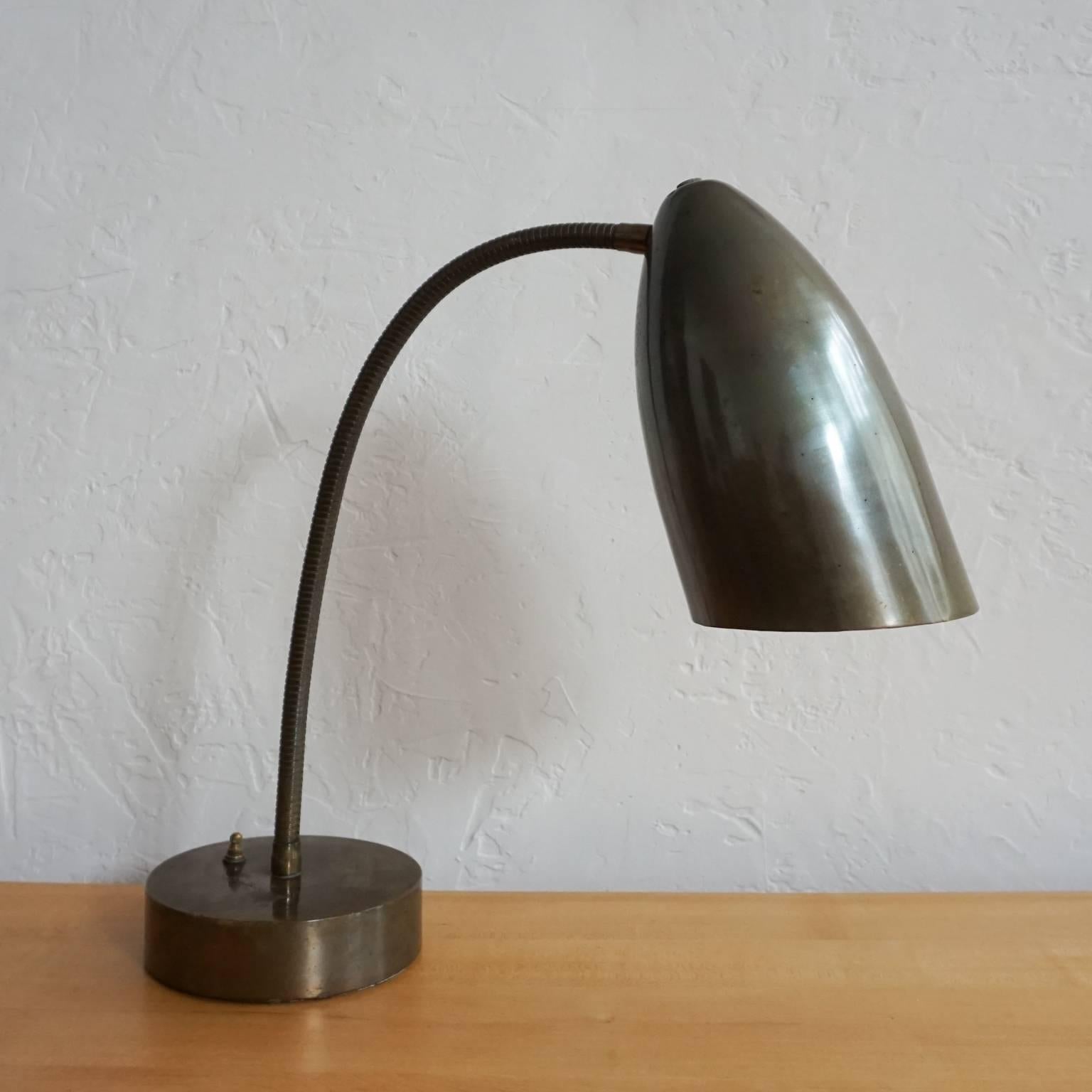 1950s adjustable desk lamp produced by the boutique San Francisco lighting company, Bulmore. The quality and substantial build quality of this lamp is unmatched. 

Dudley Bulmore and his son Robert ran the lighting company. Robert lived in an