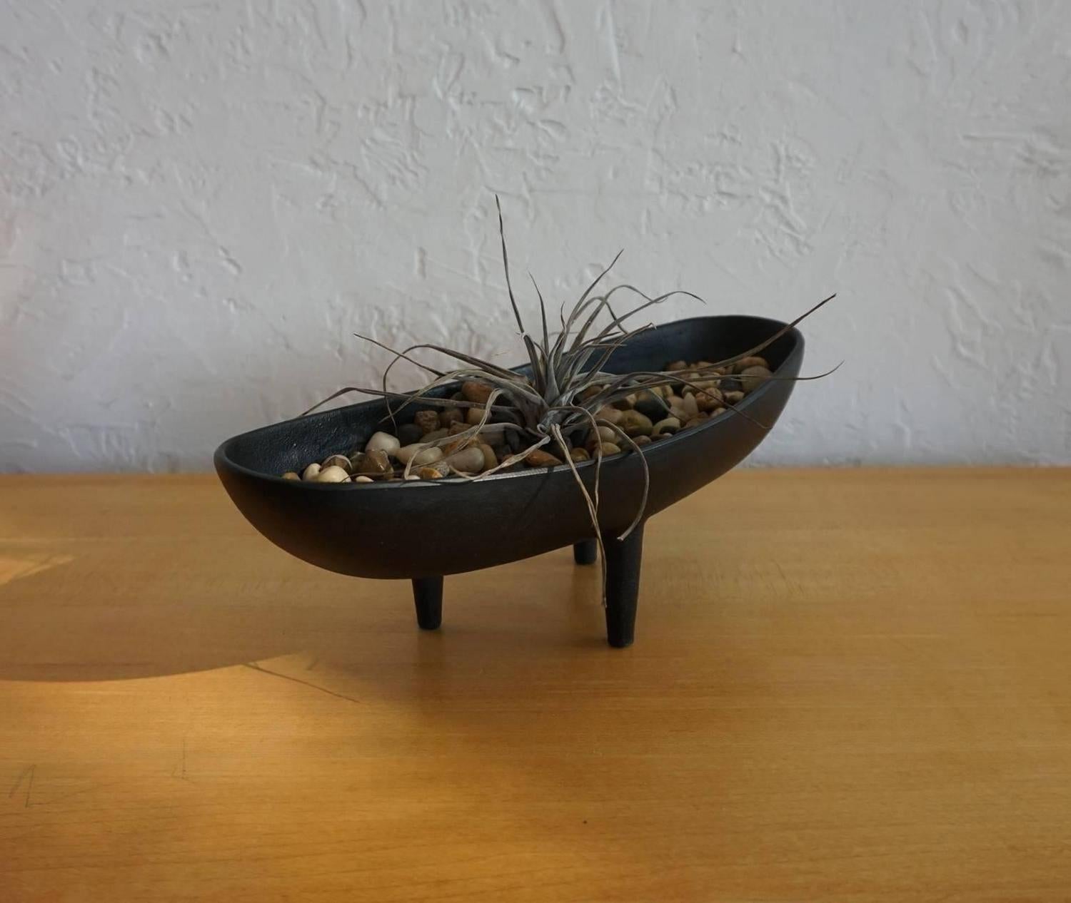 Mid-Century solid cast iron Ikebana vessel from Japan. There are three legs. Unsigned.