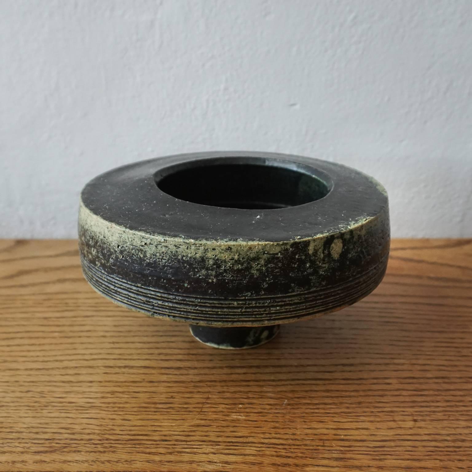 1950s Ikebana planter from Japan. Black, with green and yellow under-glaze. Subtle and fantastic off-centre opening.
