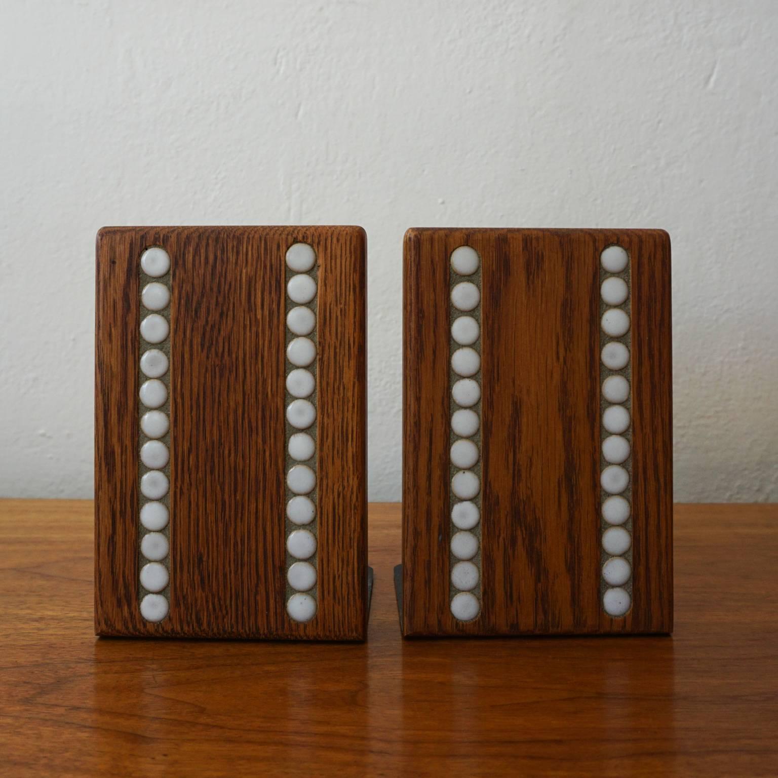 Bookends with ceramic tile by Jane and Gordon Martz for their company, Marshall Studios.
