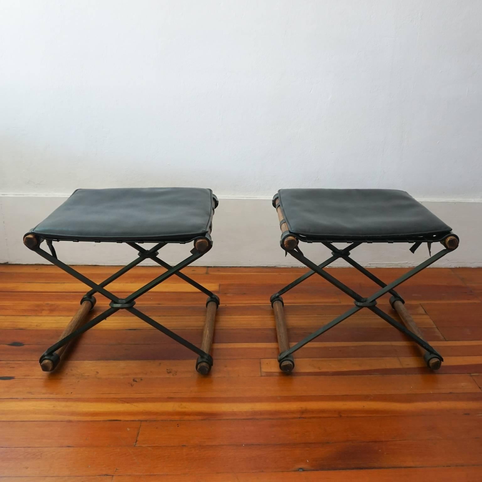 A pair of Cleo Baldon for Terra of California X stools with original pads. Iron and oak, 1970s.