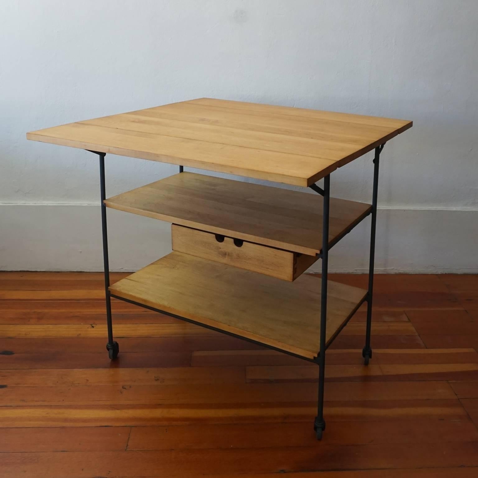 1950s Planner Group bar or serving cart with folding top and drawer. Iron and maple. Designed by Paul McCobb for Winchendon Furniture Company.