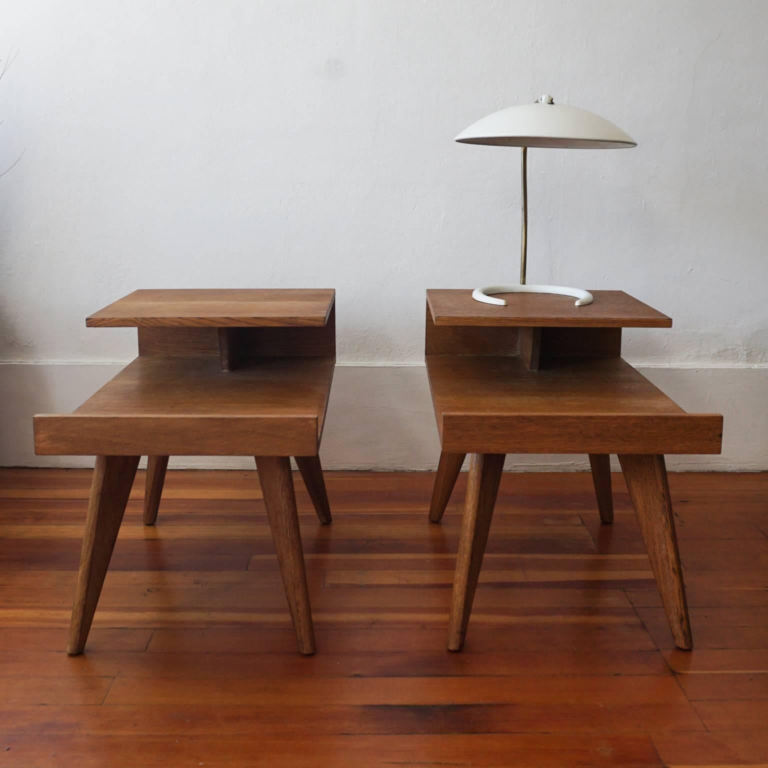 A pair of end tables designed by Dan Johnson for Los Angeles-based company, Hayden Hall. Original mahogany finish. Only made for one year, 1947. A great architectural design.