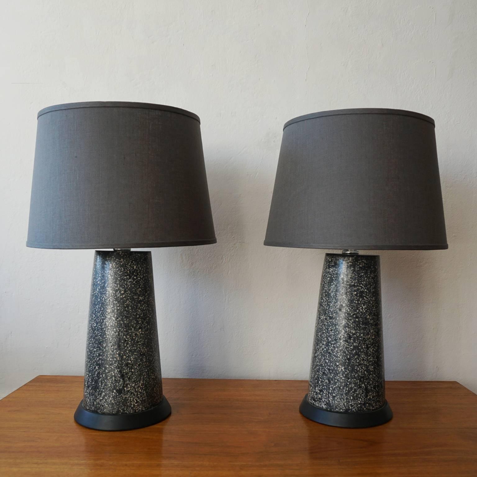 Pair of terrazzo table lamps. Slightly tapered cylinders. New dark gray shades. Rewired, 1950s.