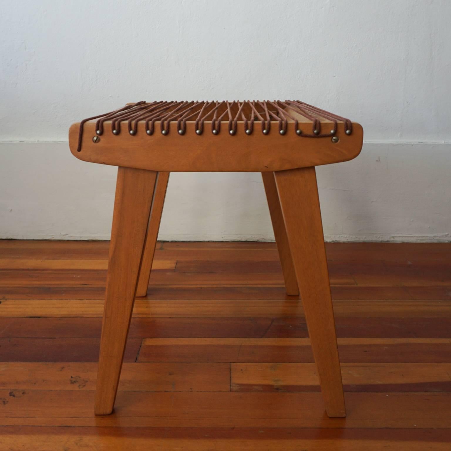 Wood and string stool by Robert J Ellenberger for Calfab Furniture Company, Los Angeles California. This design was selected for the MoMA good design exhibition in 1950. It was shown next to a VKG chair. Original string and finish.