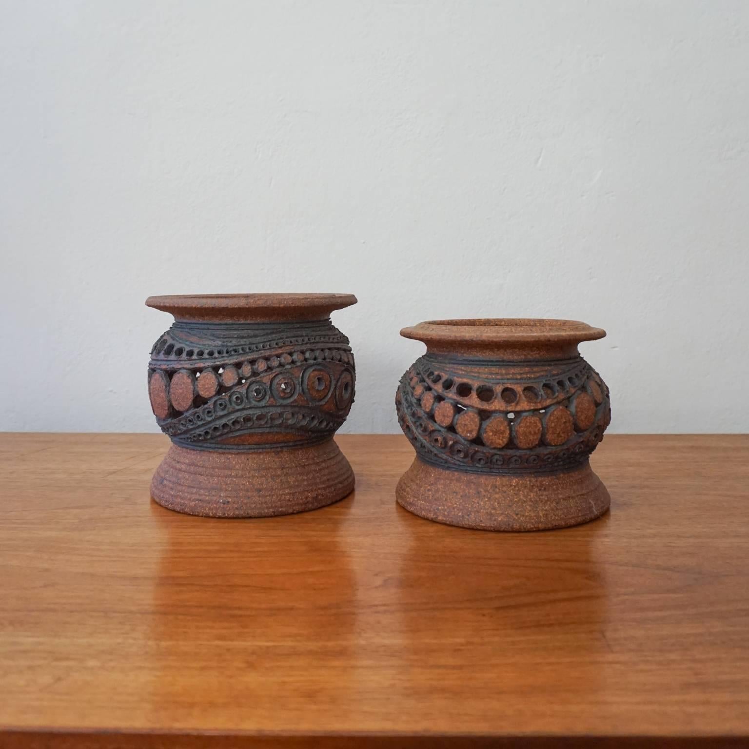 A pair of stoneware lanterns by California artist, Wayne Chapman. Signed with the artist's chop mark. 

Wayne Chapman is an important San Diego ceramic artist. He became a member of the Allied Craftsmen in the mid-1960s and exhibited with them for